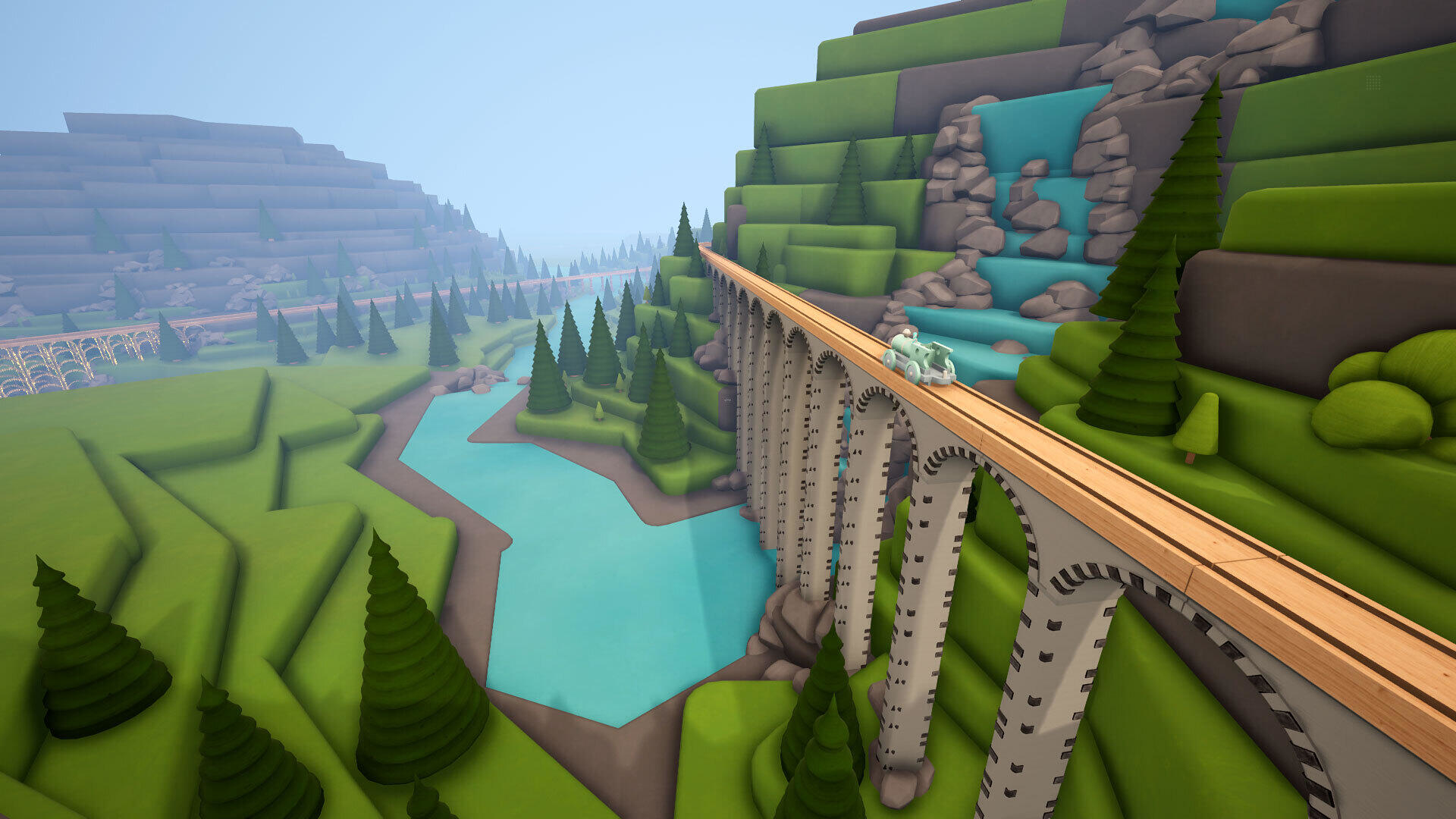 Zabawkowy pociąg na moście nad rzeką w kreskówkowym krajobrazie.