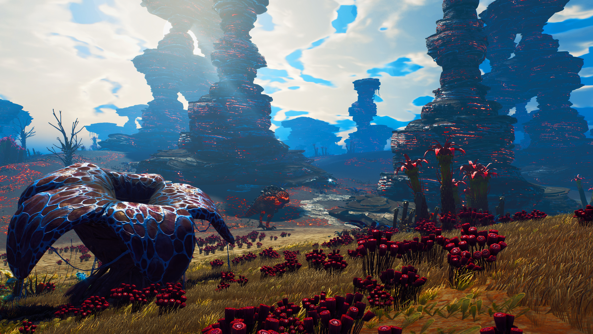 Obcy krajobraz z czerwonymi formacjami skalnymi, dużym niebiesko-brązowym grzybem i czerwoną roślinnością.