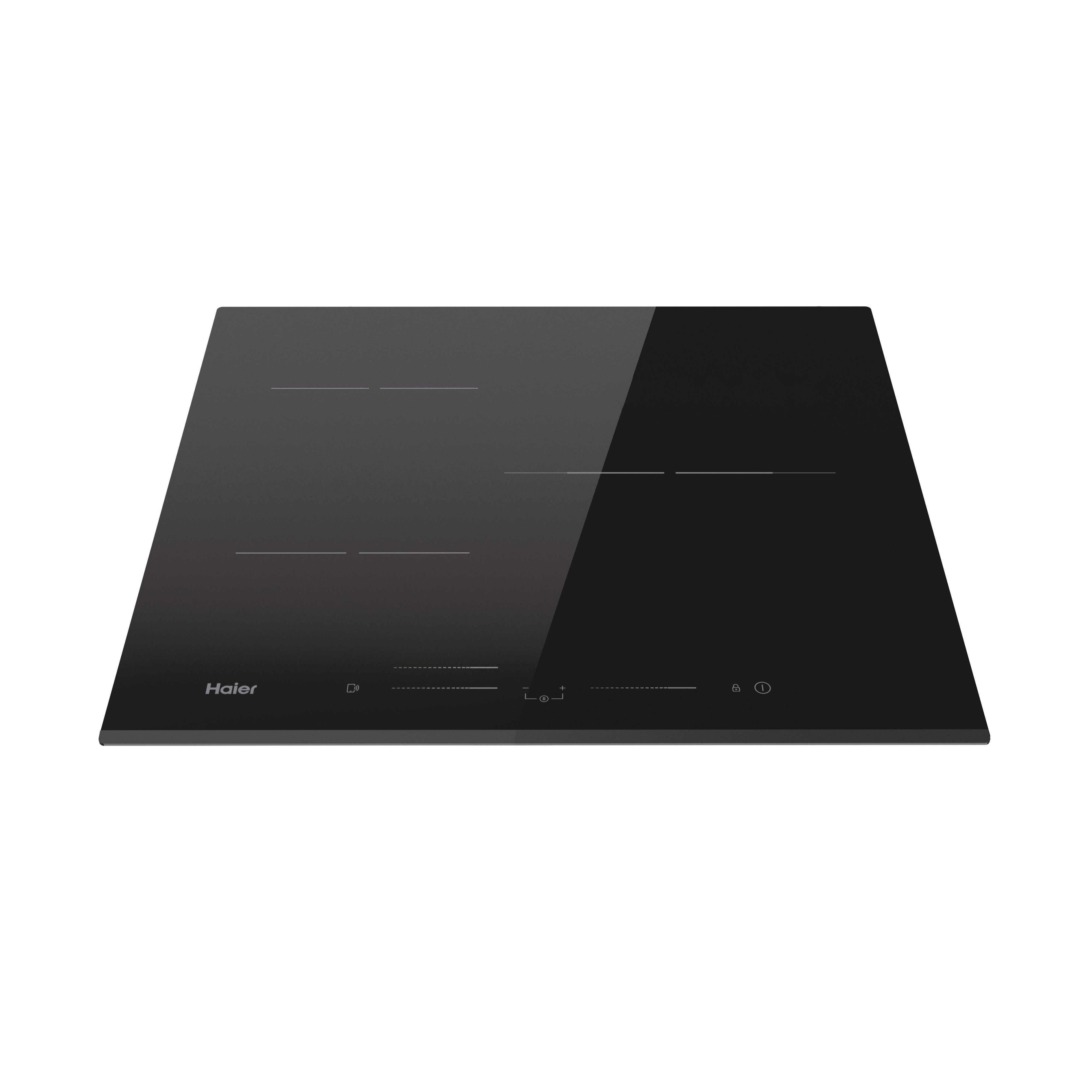 Piano cottura a induzione Haier nero su superficie bianca, comandi touch visibili.