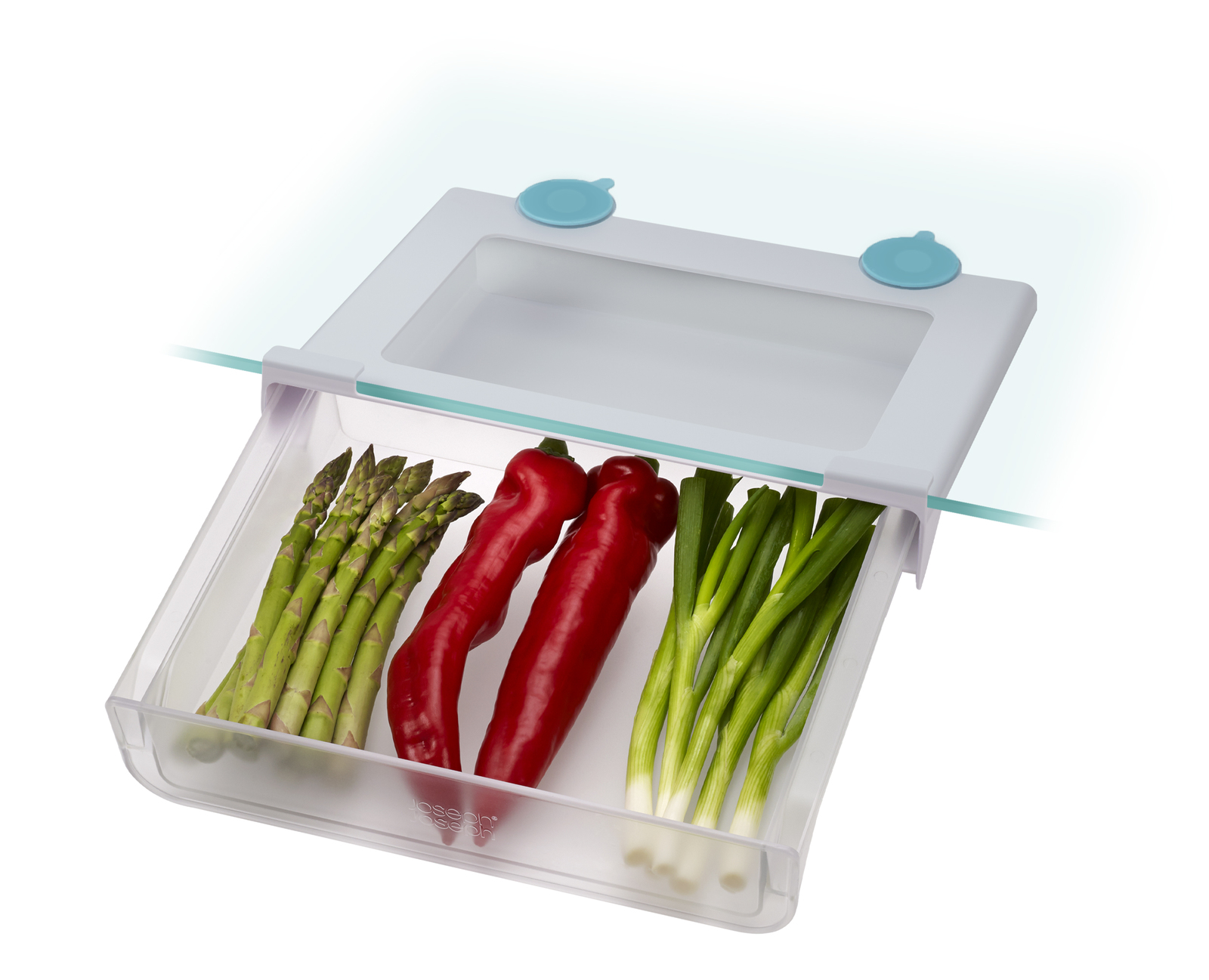 Biała plastikowa szuflada z warzywami w środku, przymocowana do szklanej powierzchni.