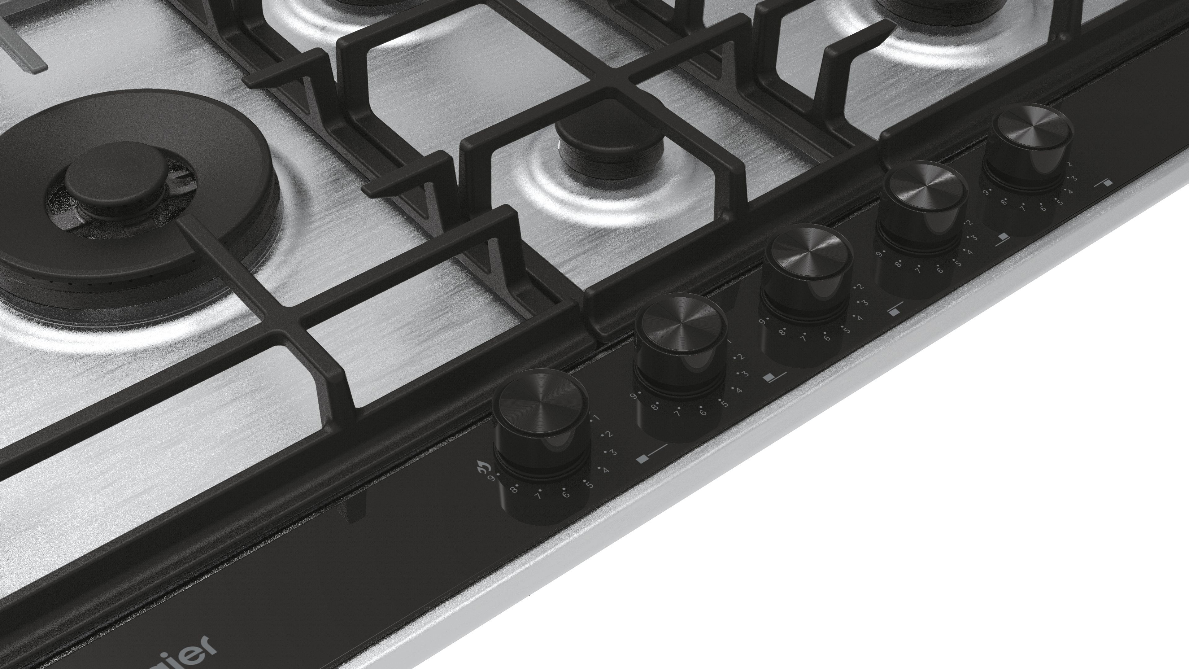 Zbliżenie kuchenki gazowej z czarnymi pokrętłami i srebrną powierzchnią.