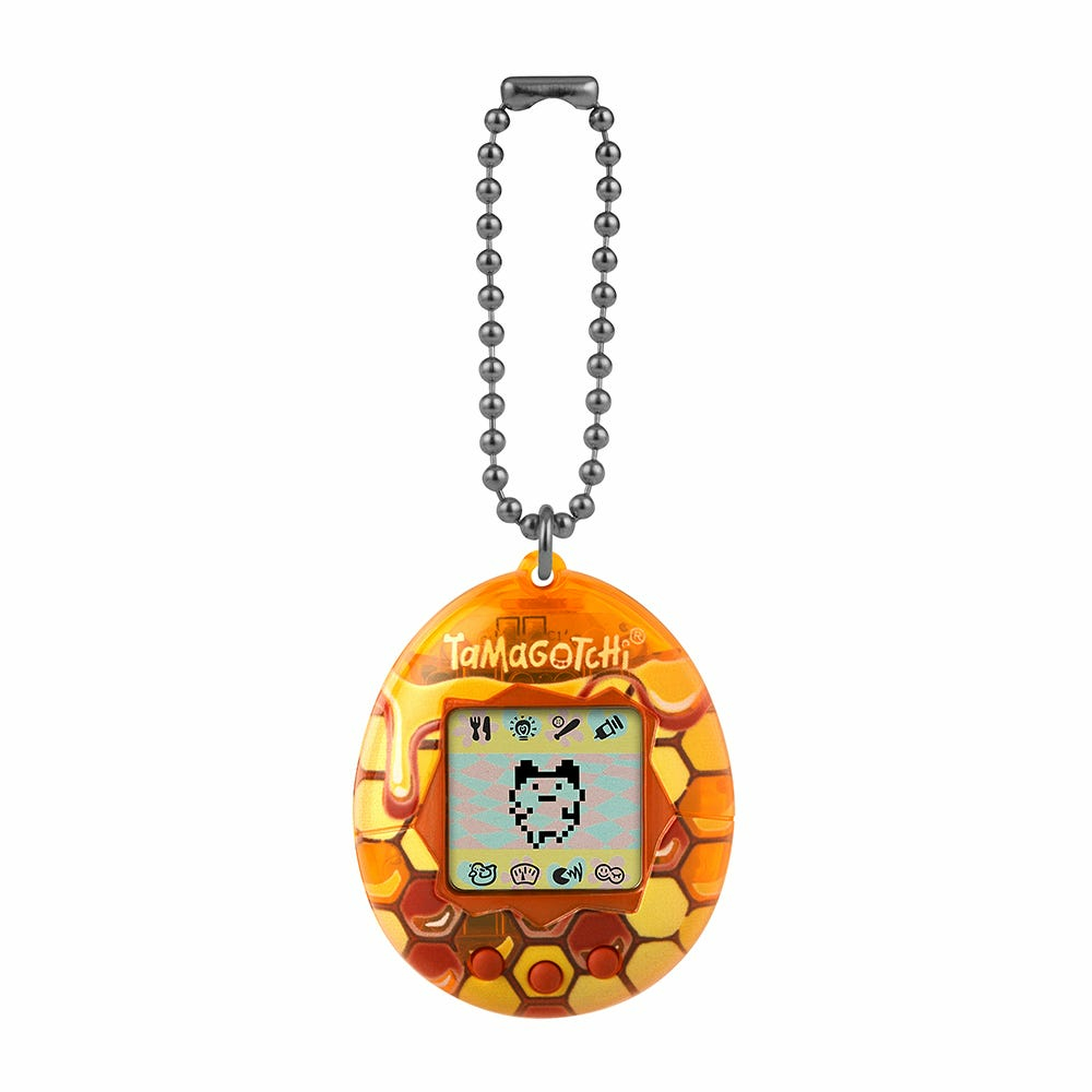 Urządzenie wirtualnego zwierzaka Tamagotchi w wzorze plastra miodu, z czarnym łańcuchem.