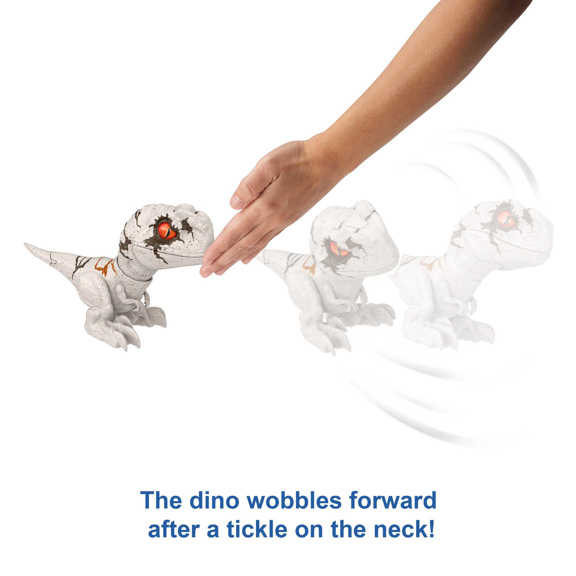 Ręka dotyka małego, białego dinozaura-zabawki. Dinozaur chwieje się do przodu.
