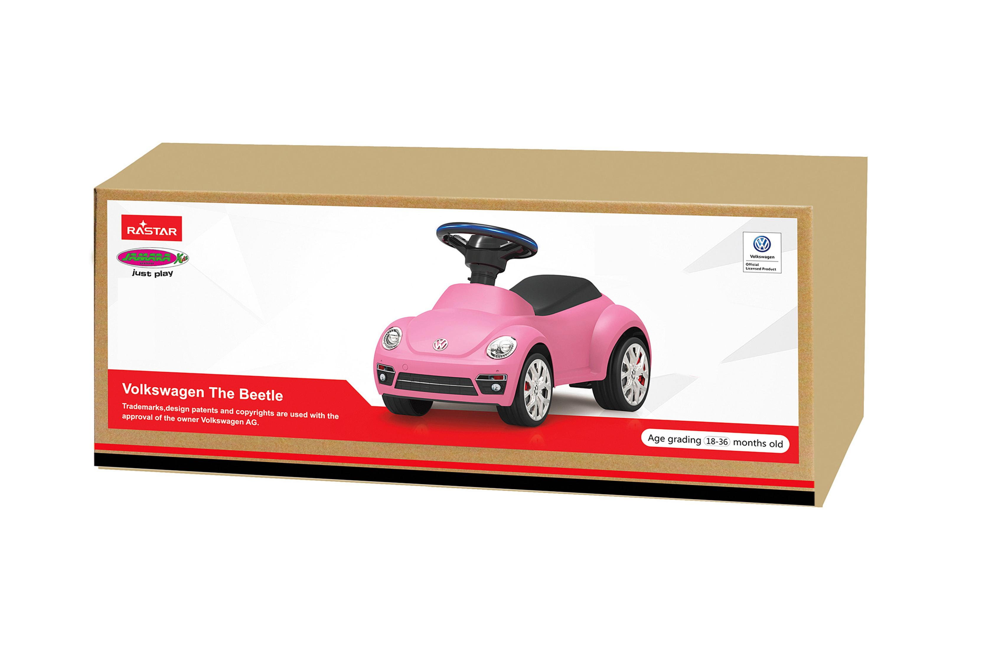 Ein rosa Spielzeugauto in einem Karton. Das Auto ist ein VW Käfer.