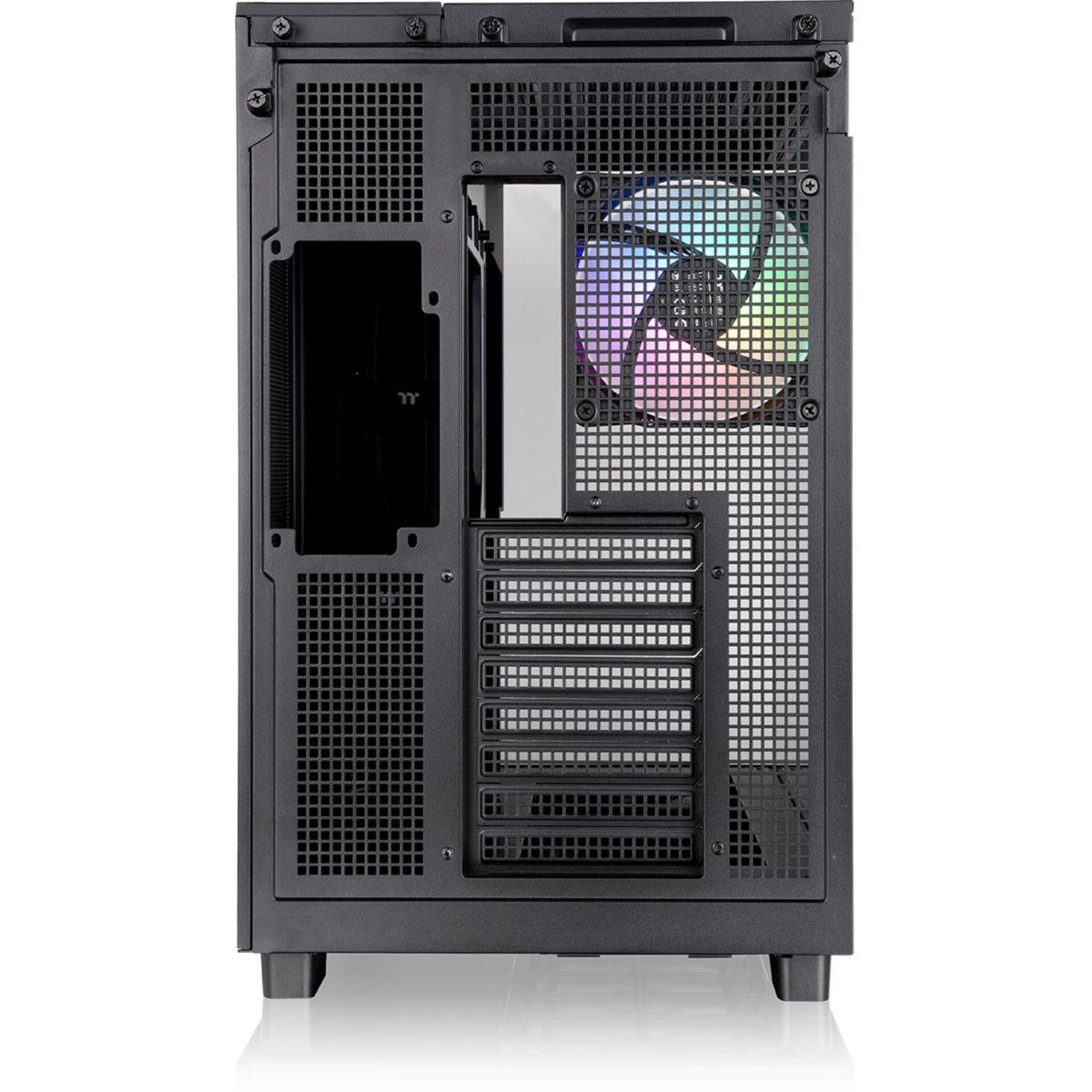 Back of a black computer case with a rainbow fan and various openings.