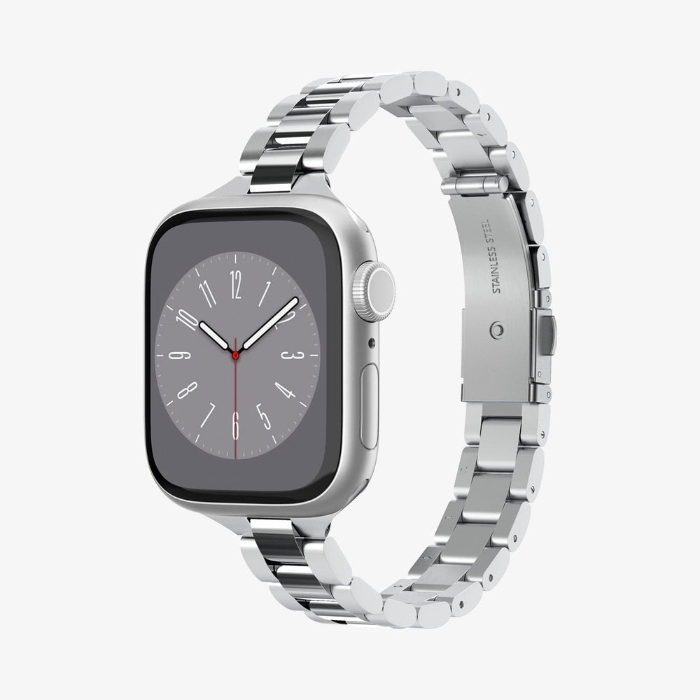 Apple Watch argento con cinturino in metallo. Lo schermo mostra l'ora.