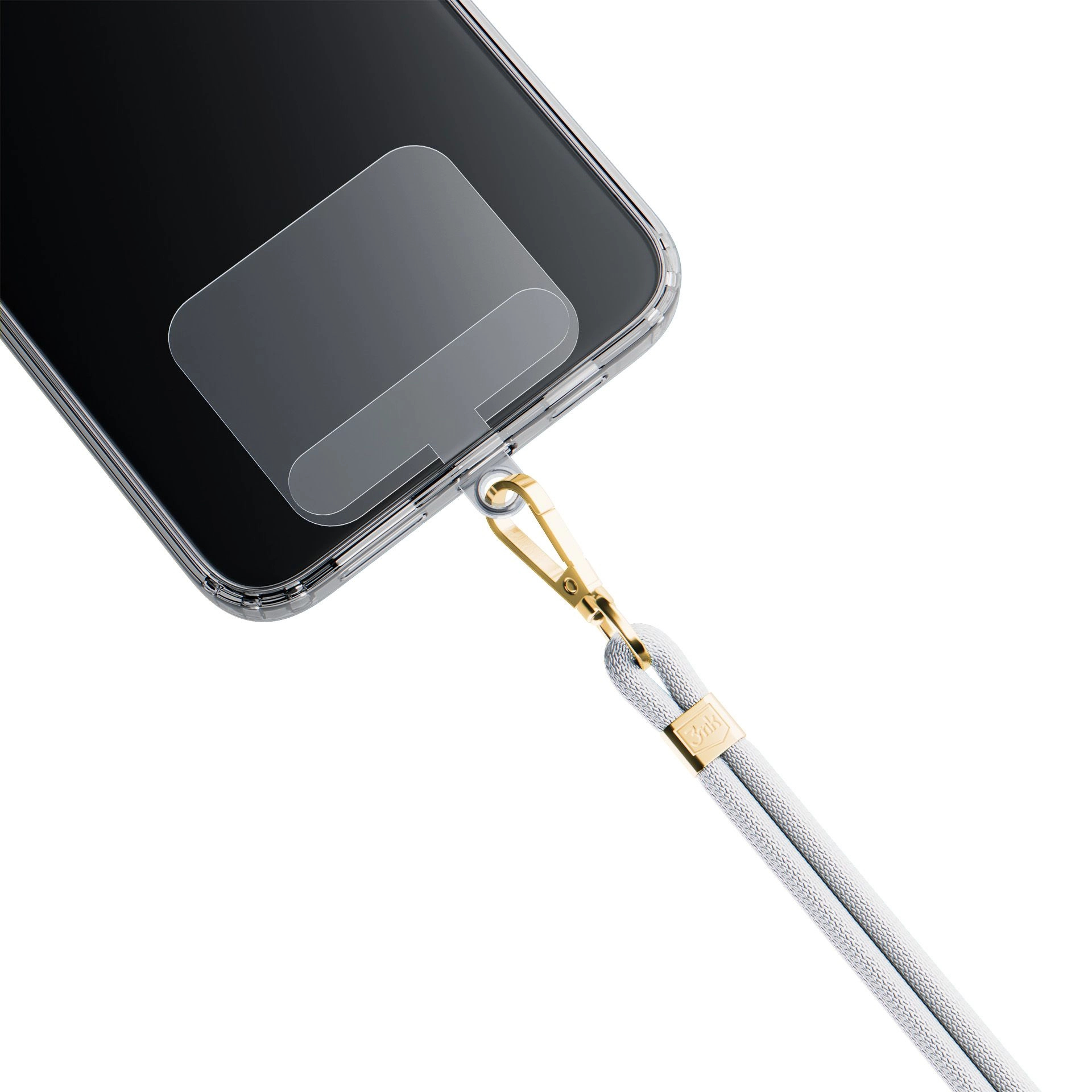 Smartfon z przezroczystym etui i smyczą. Smycz jest biała ze złotymi akcentami.