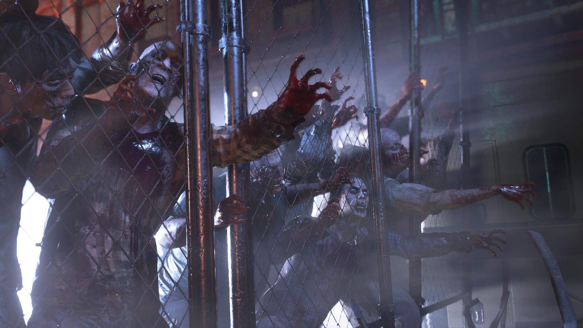 Zombi dietro una recinzione metallica, che si protendono. Sangue e orrore visibili. Scena cupa e cruda.
