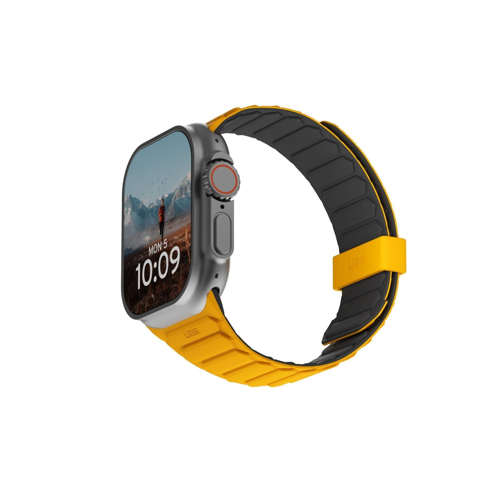 Smartwatch z żółtym paskiem pokazujący godzinę i obraz krajobrazu.