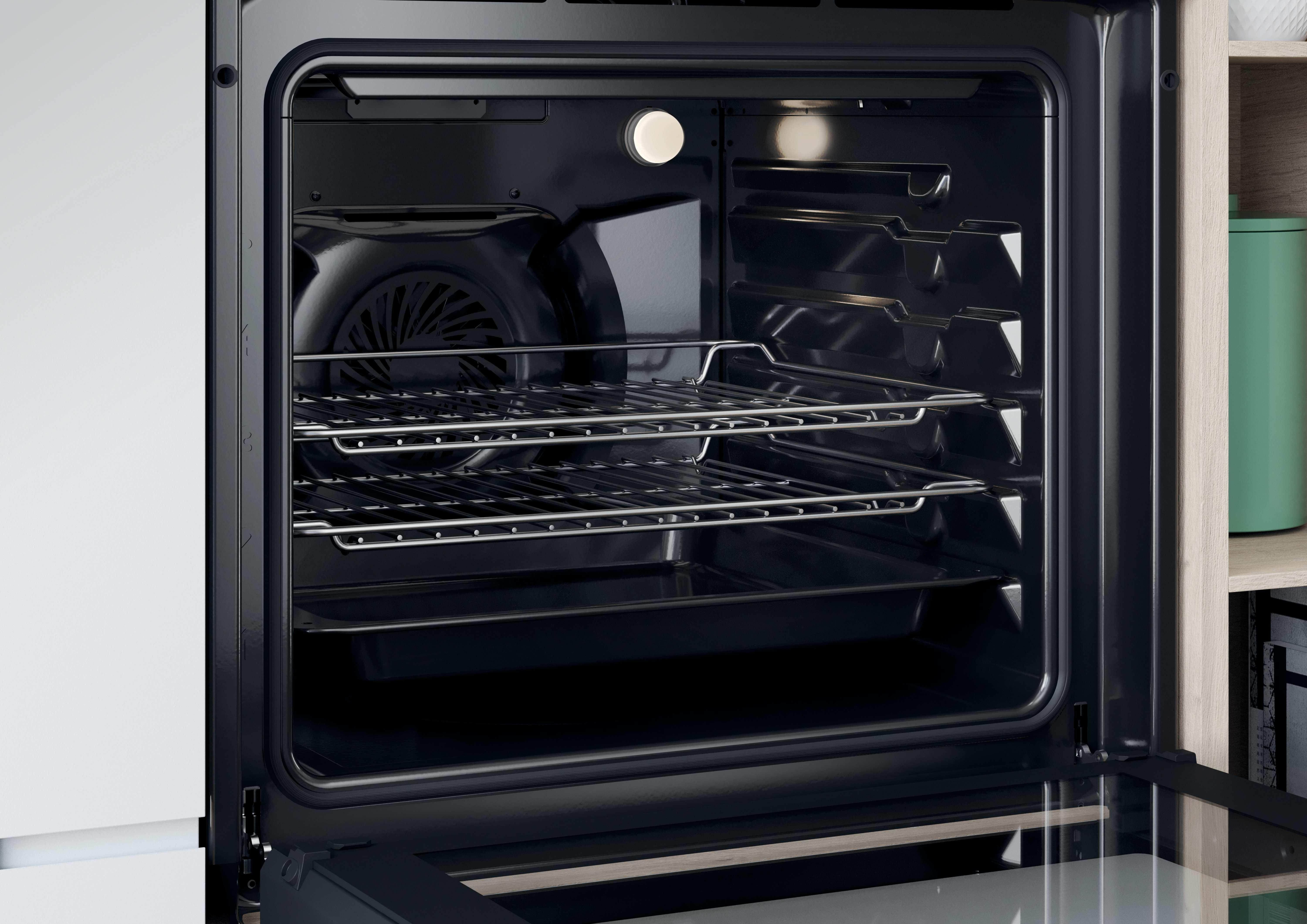 Forno aperto con griglie all'interno. Forno nero con acciaio inossidabile.