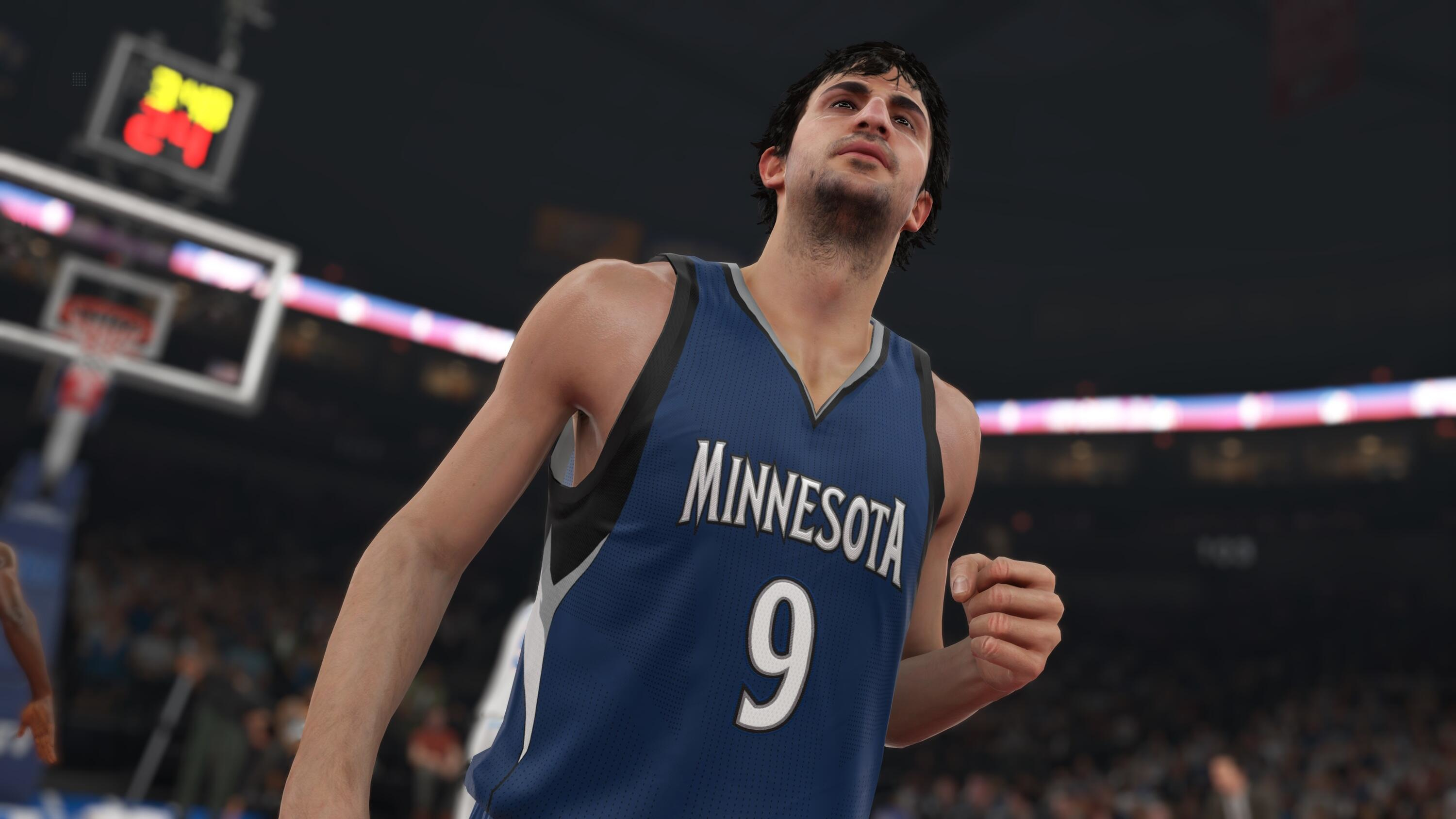Jugador de baloncesto con camiseta azul con la palabra 'MINNESOTA' y el número '9'.