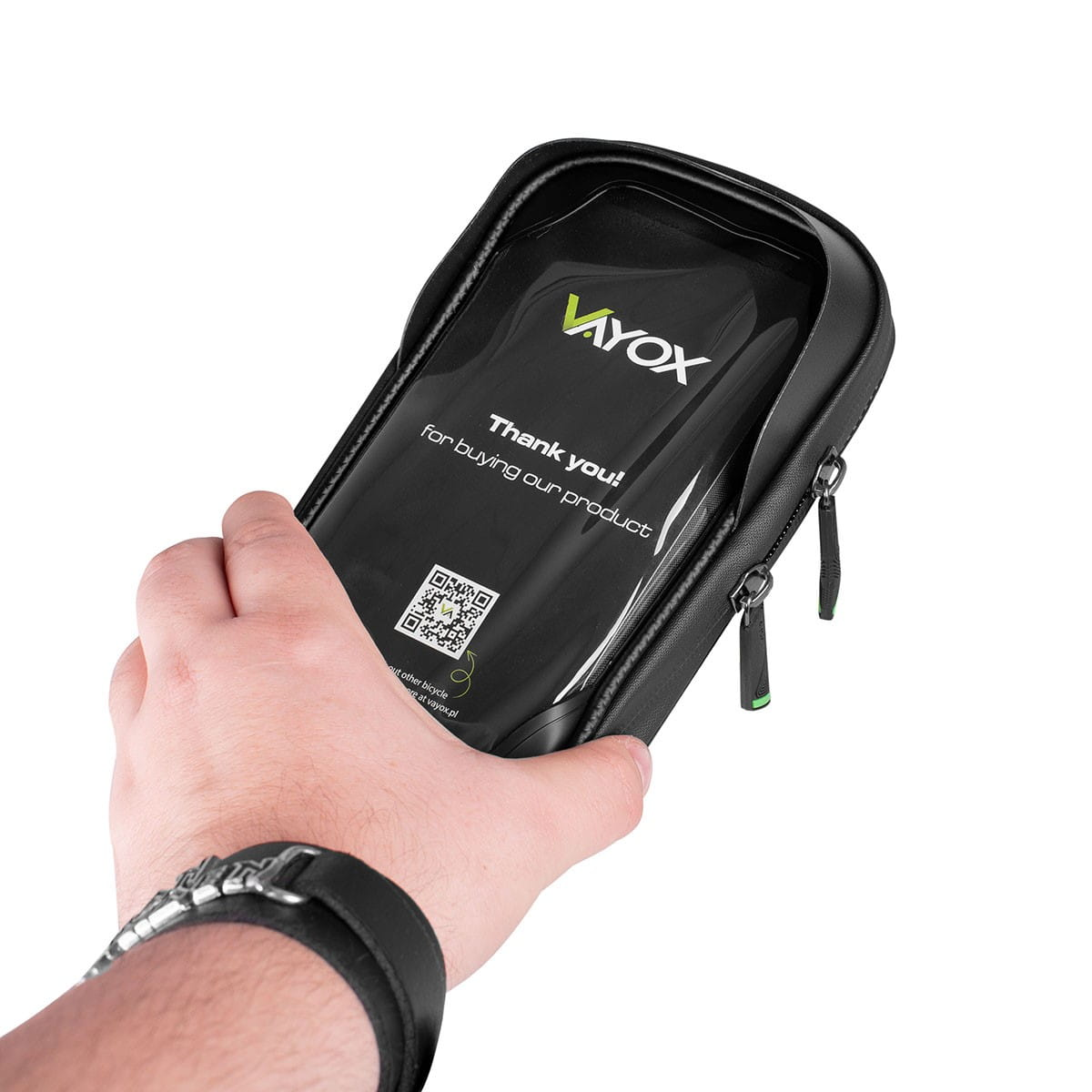 Ręka trzyma czarną torebkę z oknem. Tekst: Dziękujemy za zakup.