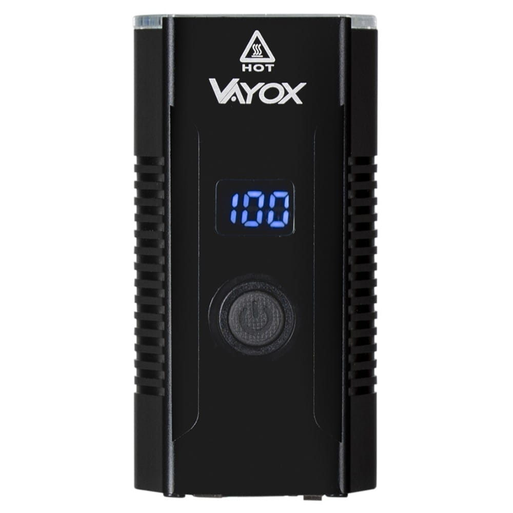 Czarne urządzenie Vayox z wyświetlaczem cyfrowym '100'. Pod wyświetlaczem przycisk.