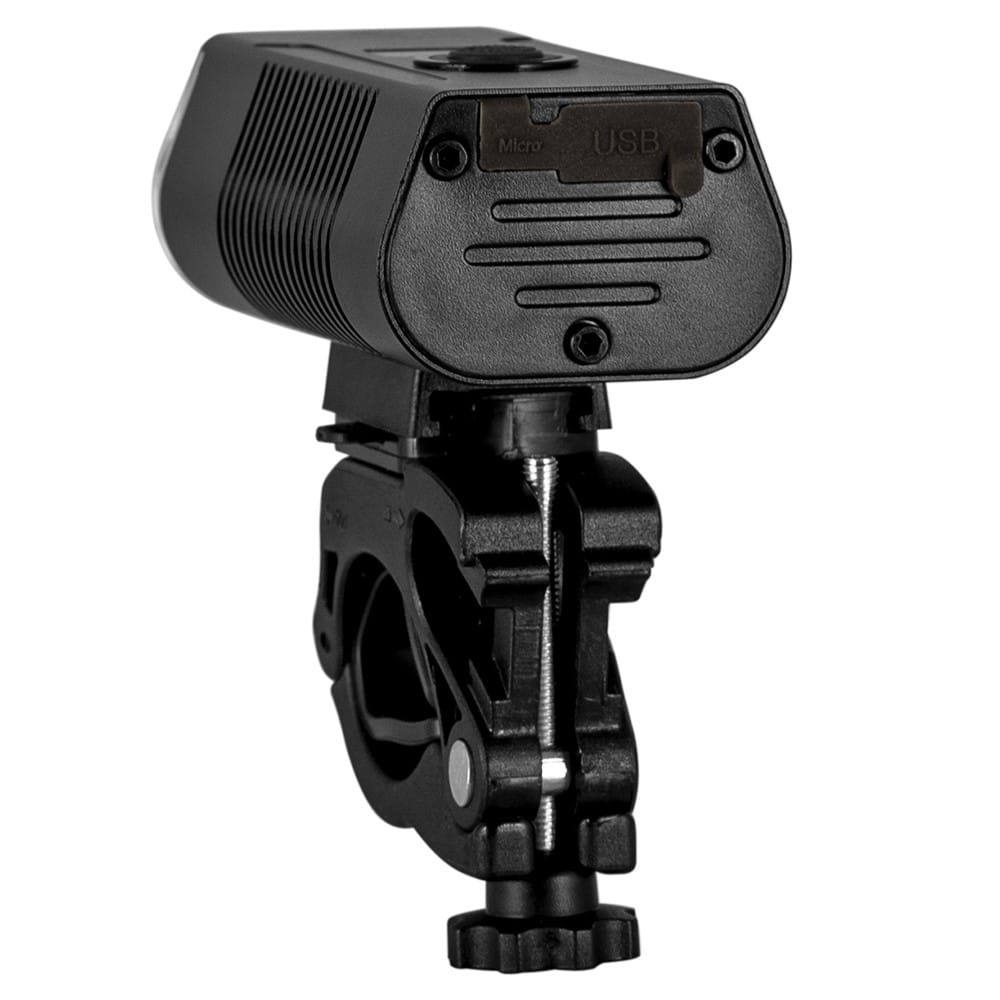 Czarna lampka rowerowa przymocowana do wspornika. Posiada port USB i port Micro.