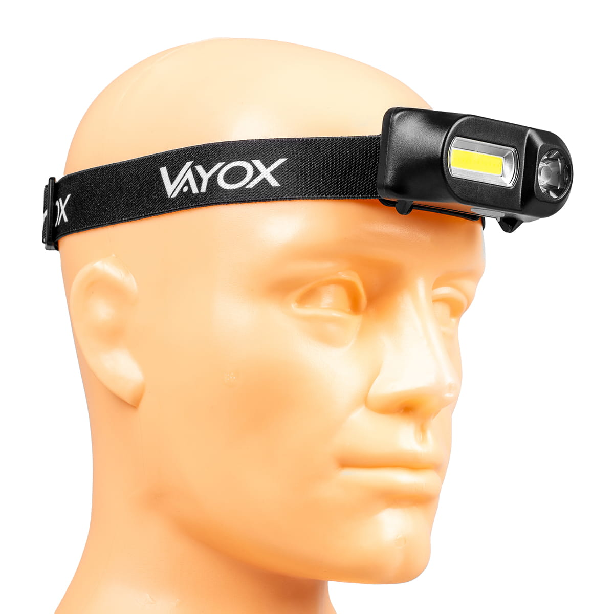 Latarka czołowa na głowie manekina. Głowa jest beżowa, a pasek czarny.