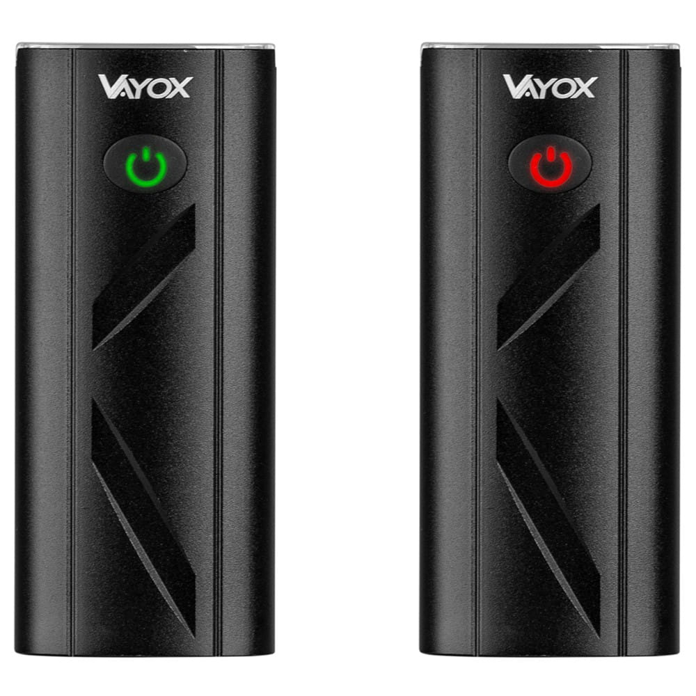 Dwie czarne lampki rowerowe Vayox, jedna z zielonym, druga z czerwonym przyciskiem.