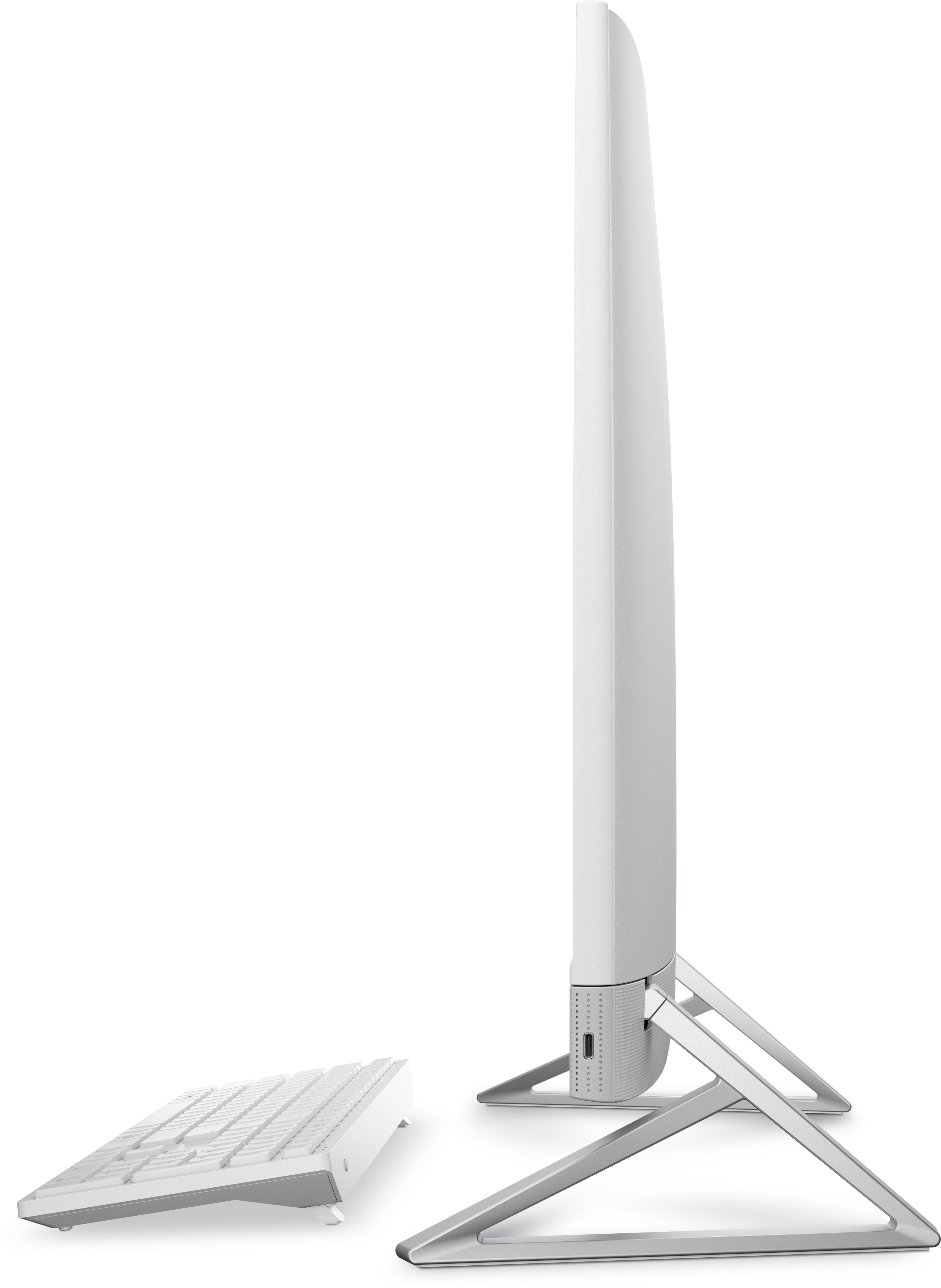 Widok z boku białego komputera, z klawiaturą i podstawką, na białym tle.