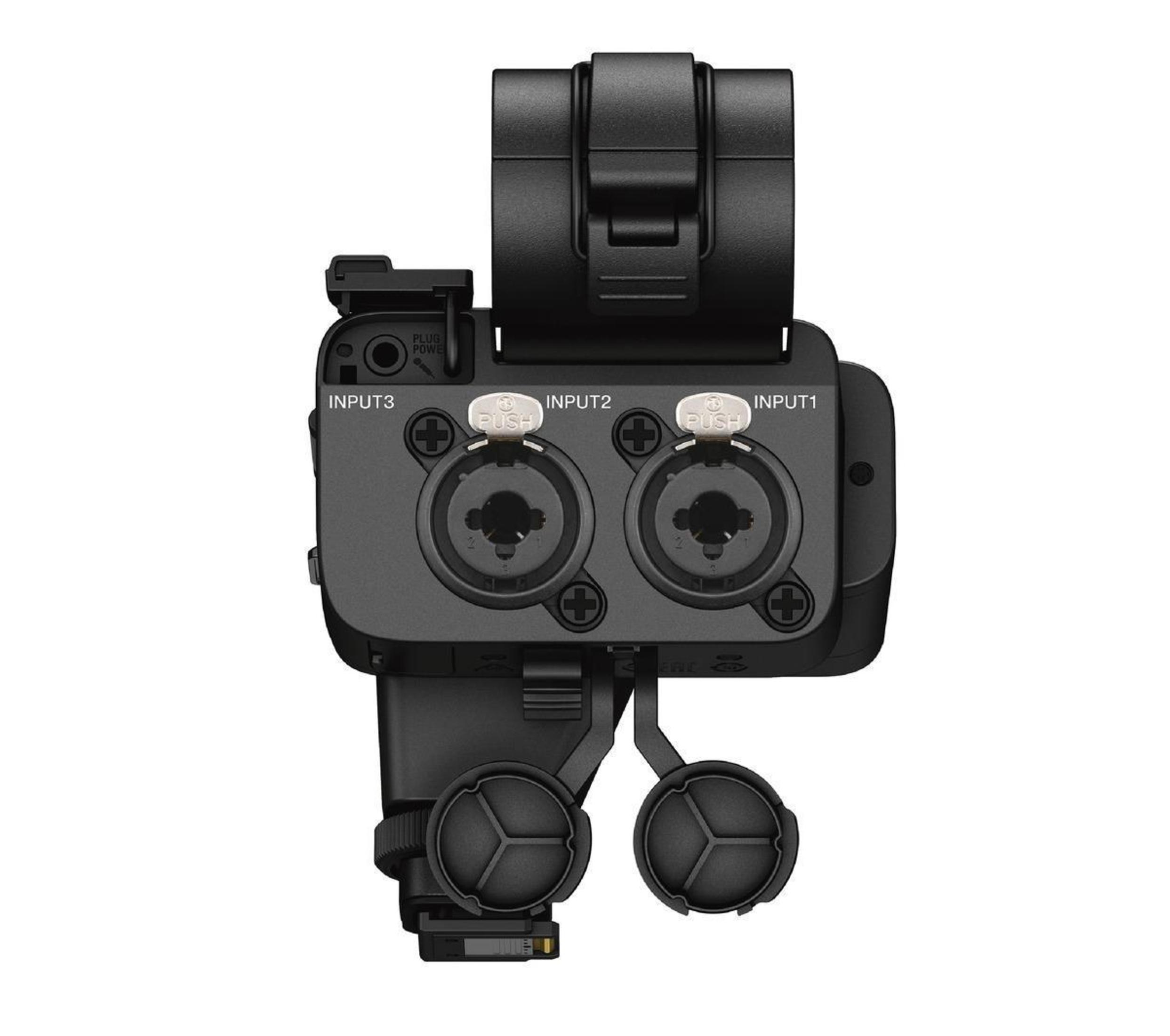 Czarny interfejs audio z oznaczonymi wejściami i złączami.