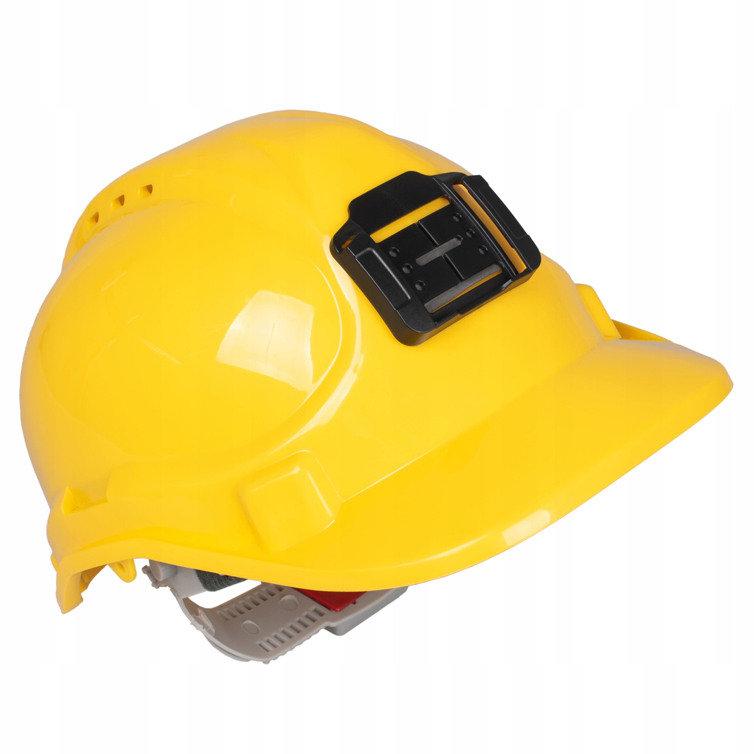Żółty kask z czarnym mocowaniem. Kapelusz znajduje się na białej powierzchni.