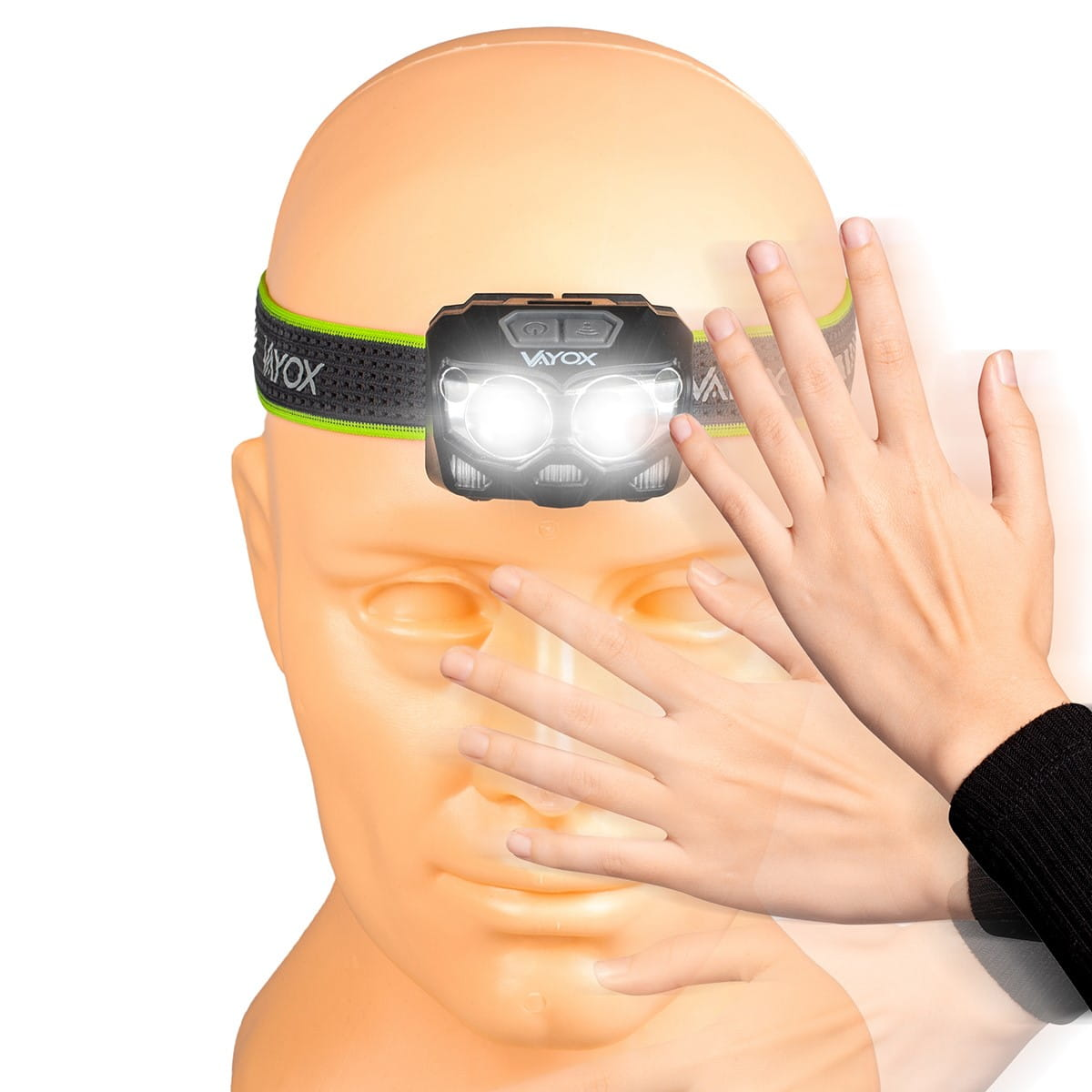 Reflektor czołowy na głowie manekina, z rękami dotykającymi manekina. Pasek jest szary i neonowo-zielony.
