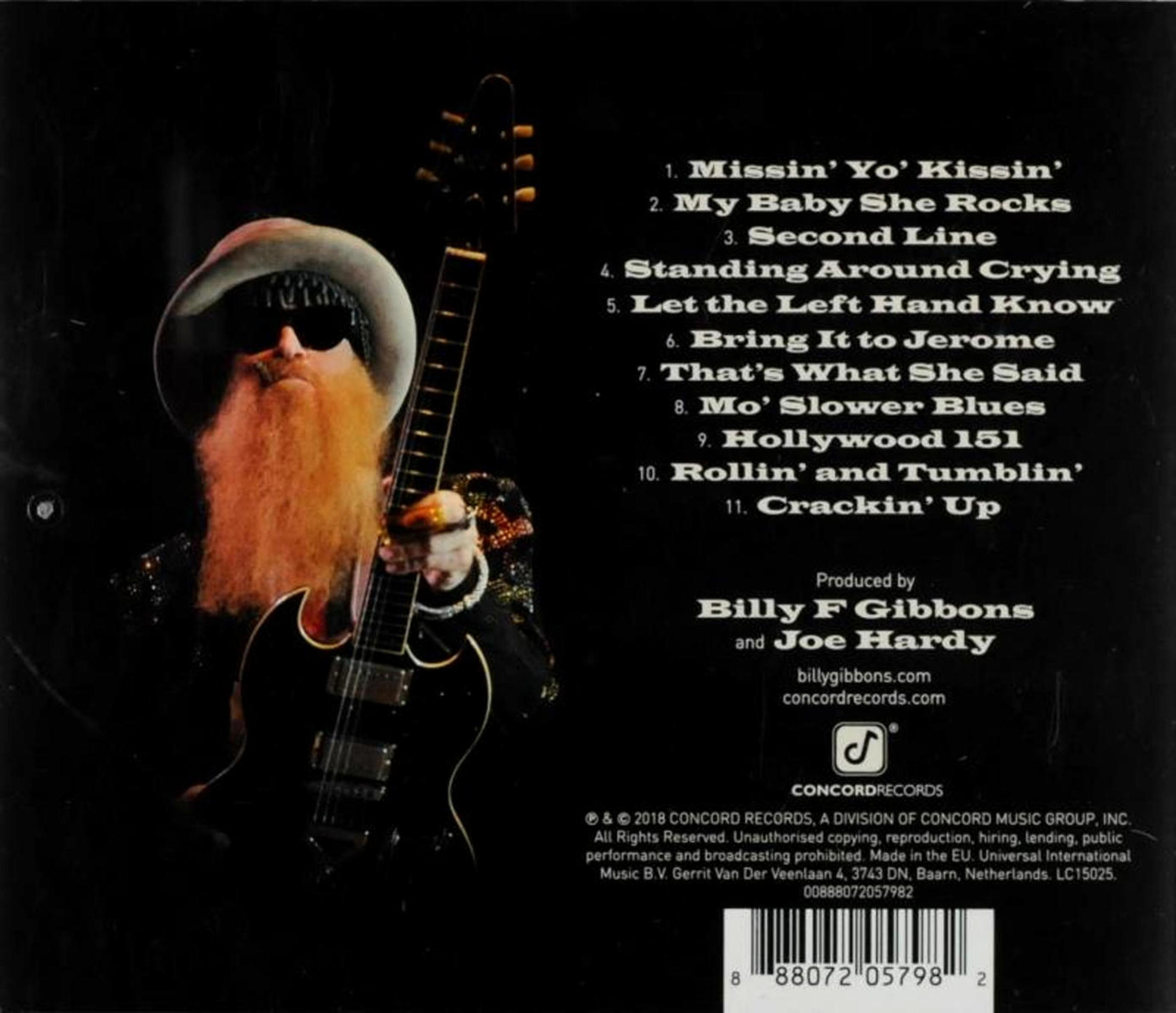 Tylna okładka albumu z tekstem, mężczyzną trzymającym gitarę i korpusem gitary.