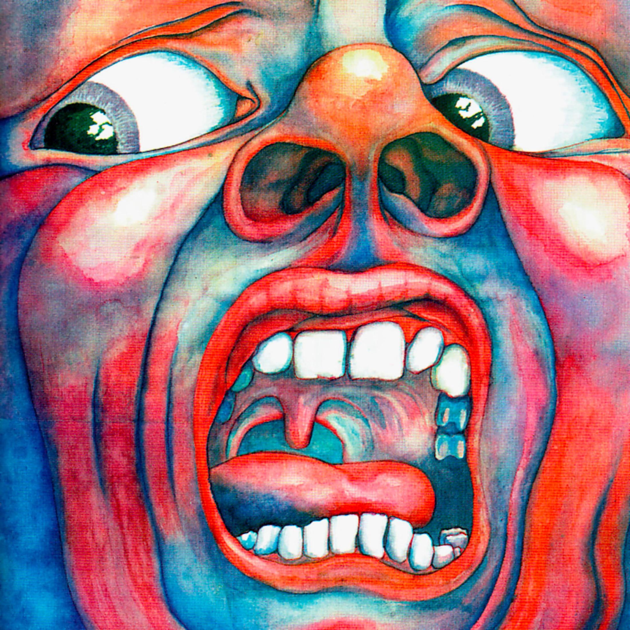 Copertina dell'album: un primo piano di un volto con bocca aperta, occhi grandi e colori rosso e blu.