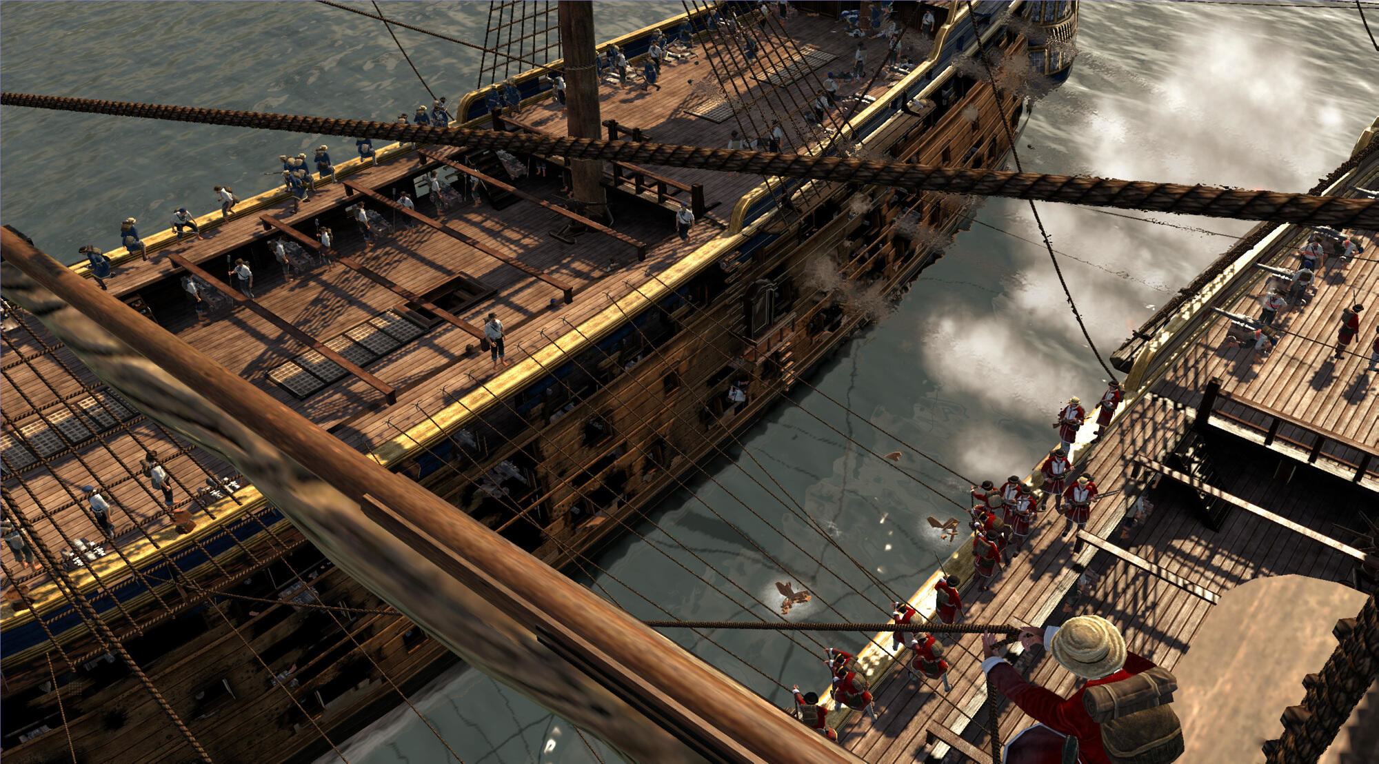 Una vista dall'alto di una nave attraccata a un molo. Ci sono persone sulla nave e sul molo.