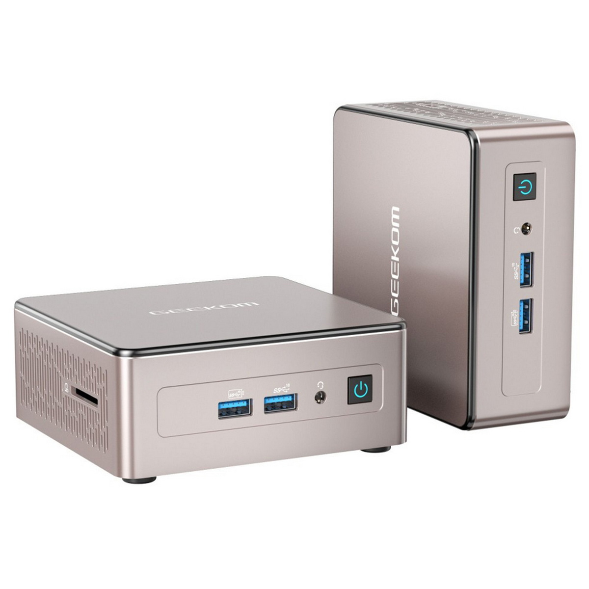 Dos mini-PC plateados, uno frontal y otro de pie. Ambos tienen puertos y botones de encendido.