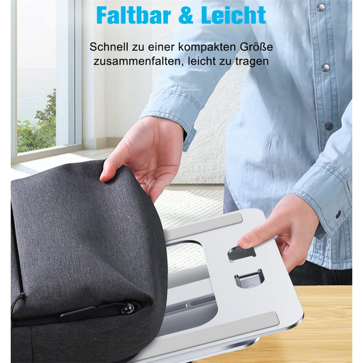 Person hält Laptop-Ständer und schwarze Laptoptasche. Der Ständer ist silber und weiß.