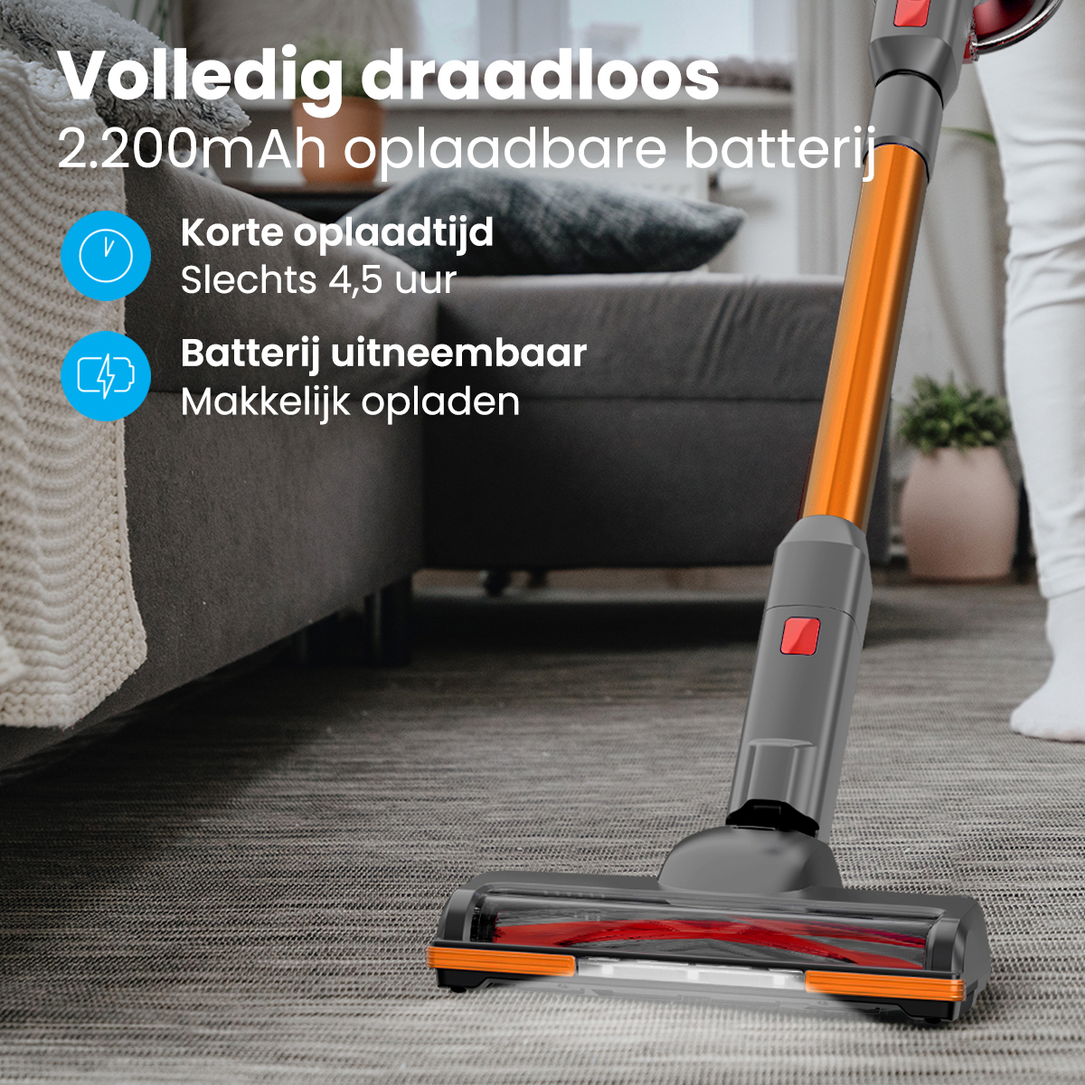 Un aspirateur sans fil avec un design orange et gris, sur un tapis.