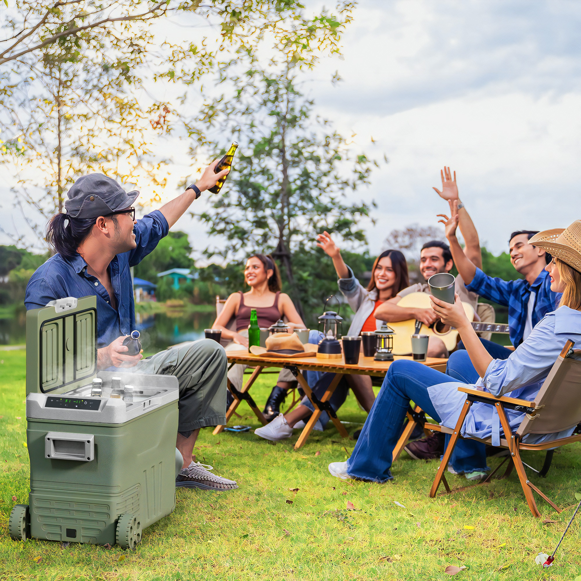 Grupo de personas en un picnic, con una nevera y cerveza.