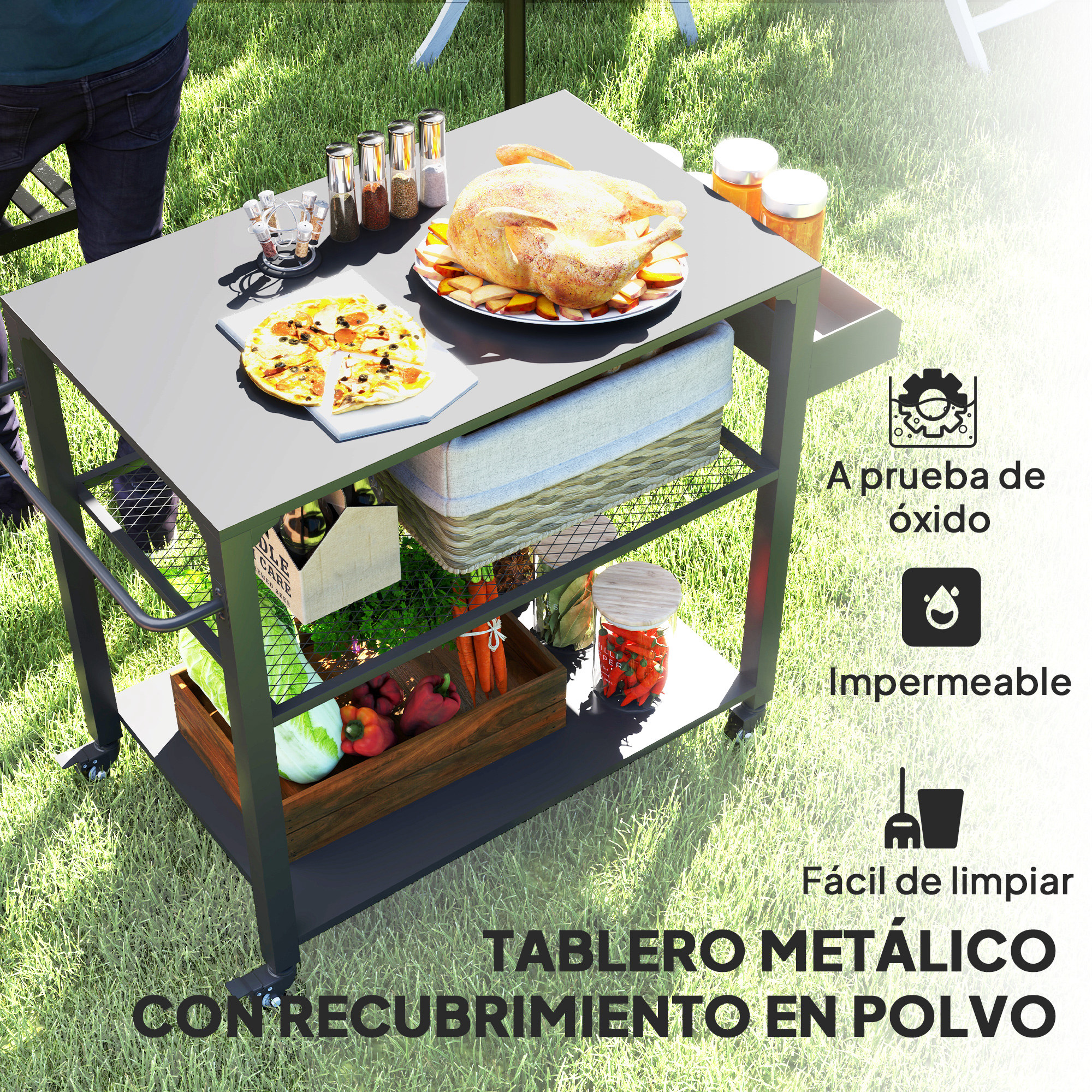 Un carrito de parrilla de metal negro con comida y suministros en un césped.