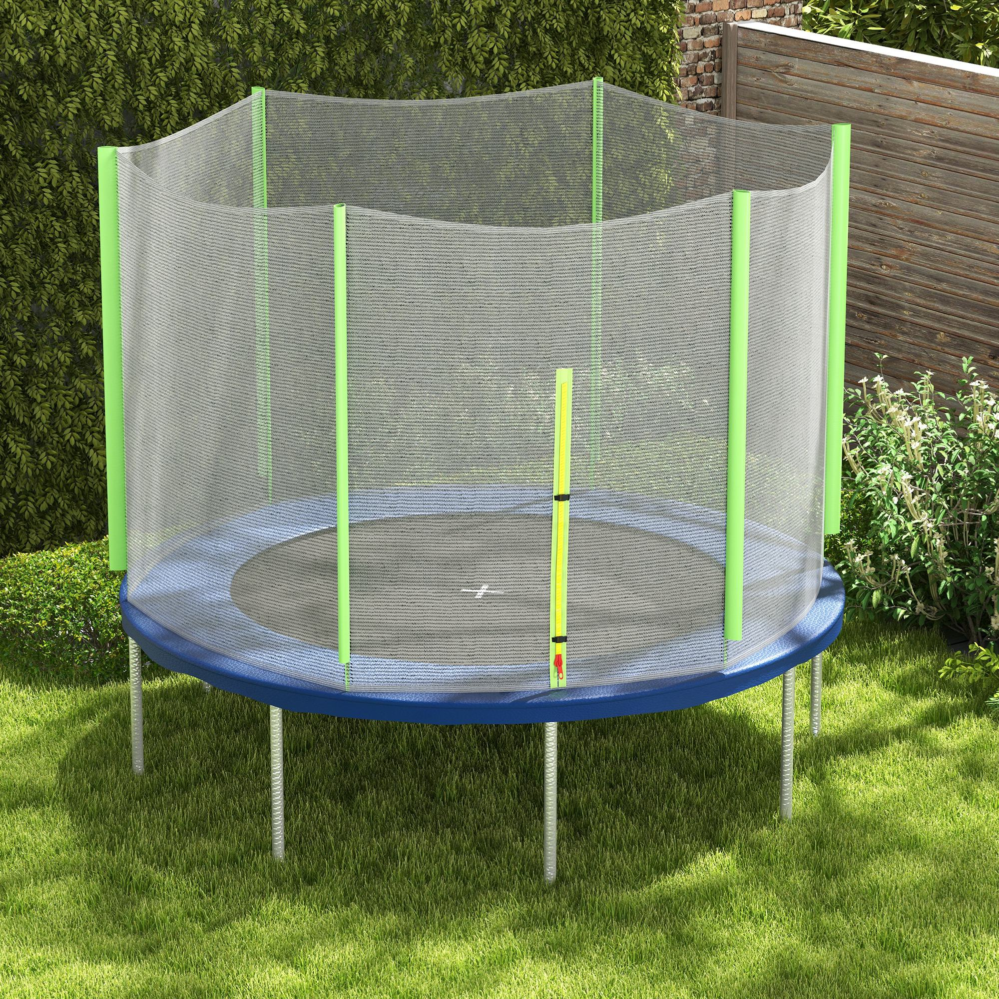 Un trampolín azul y verde instalado sobre césped. El fondo incluye vegetación.