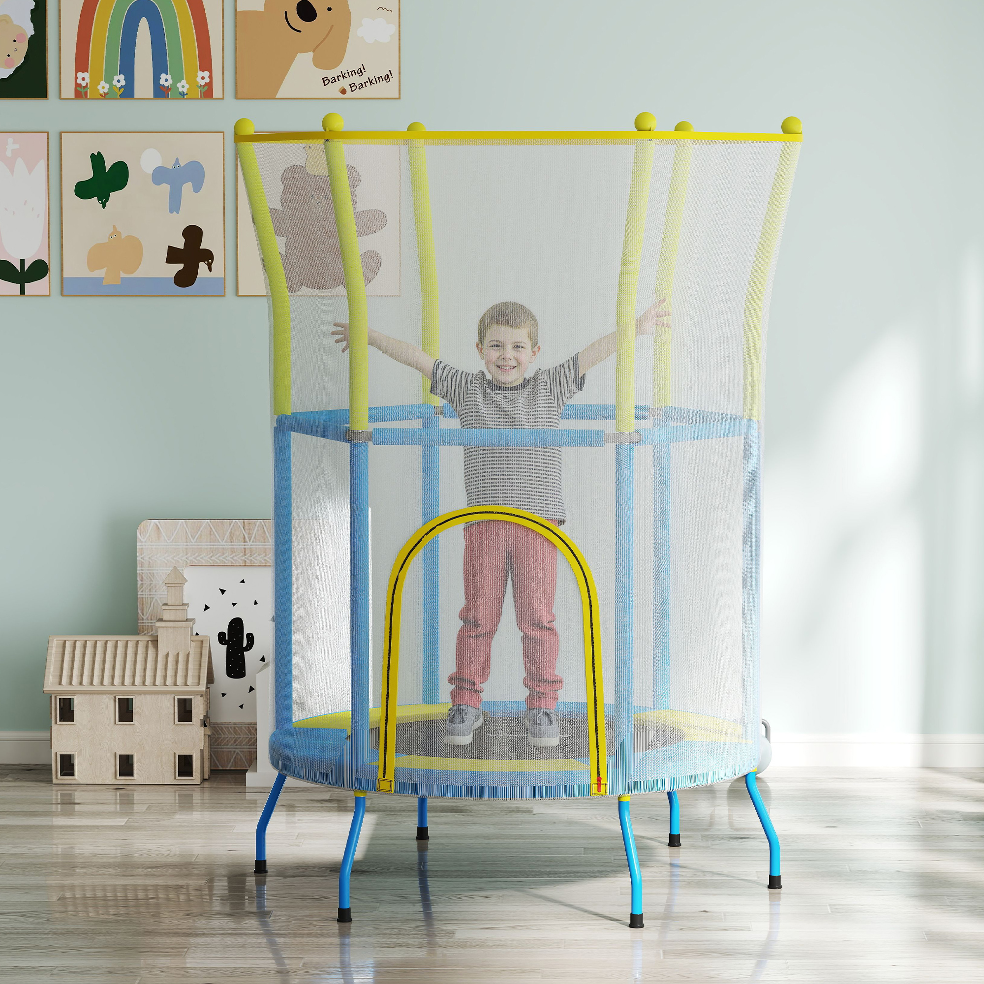 Un niño en una cama elástica azul y amarilla, con los brazos arriba, arte en la pared.