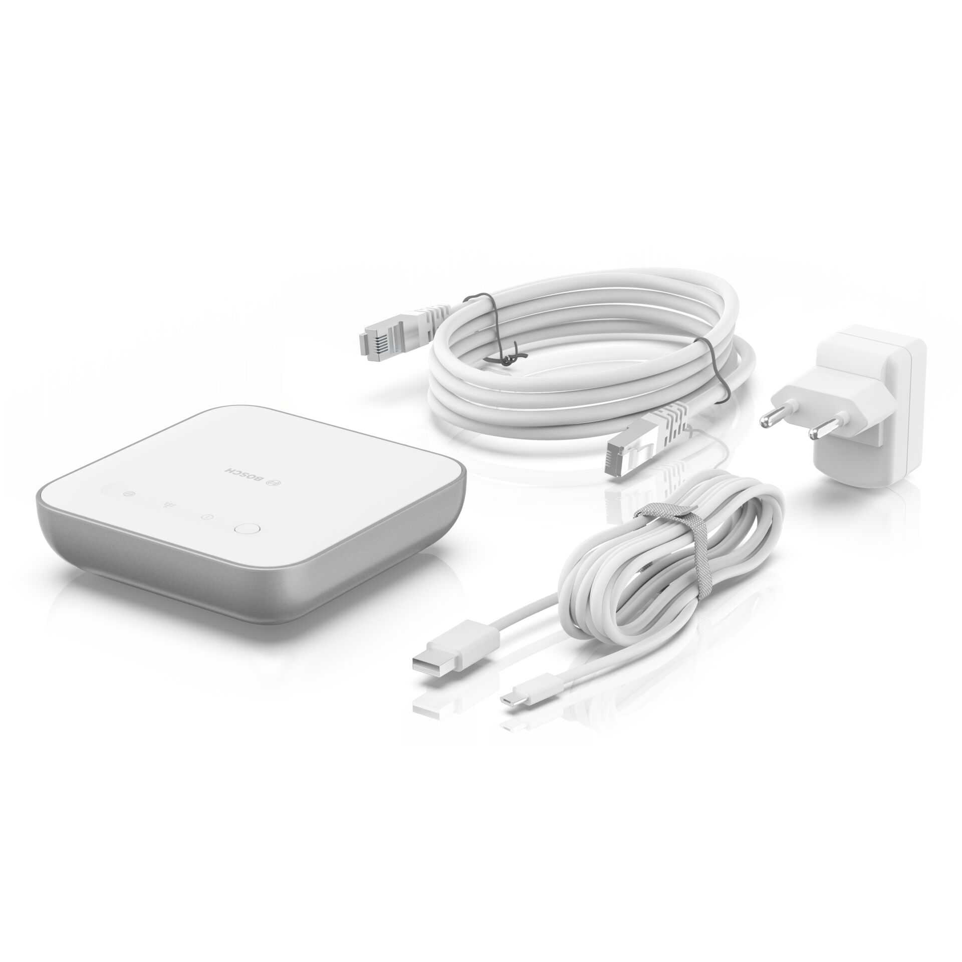 Weißes elektronisches Gerät, Kabel und Stecker auf weißem Hintergrund.