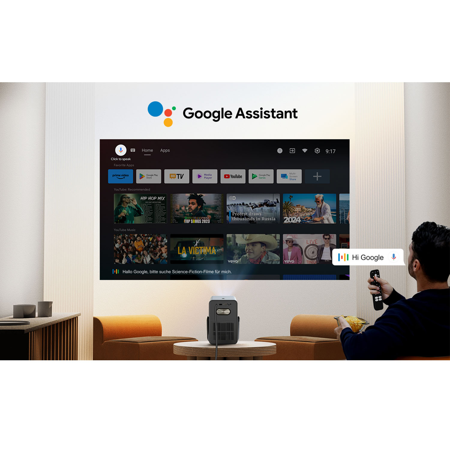 Person verwendet Google Assistant zur Steuerung eines Projektors per Fernbedienung.