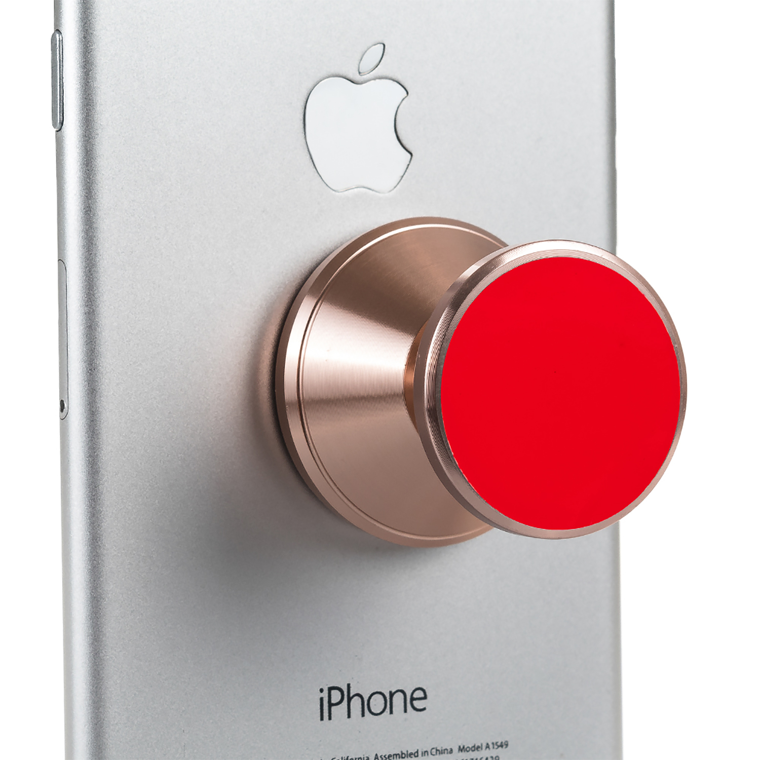 Un pop socket rojo está adherido a la parte trasera de un iPhone plateado. Logotipo de Apple visible.
