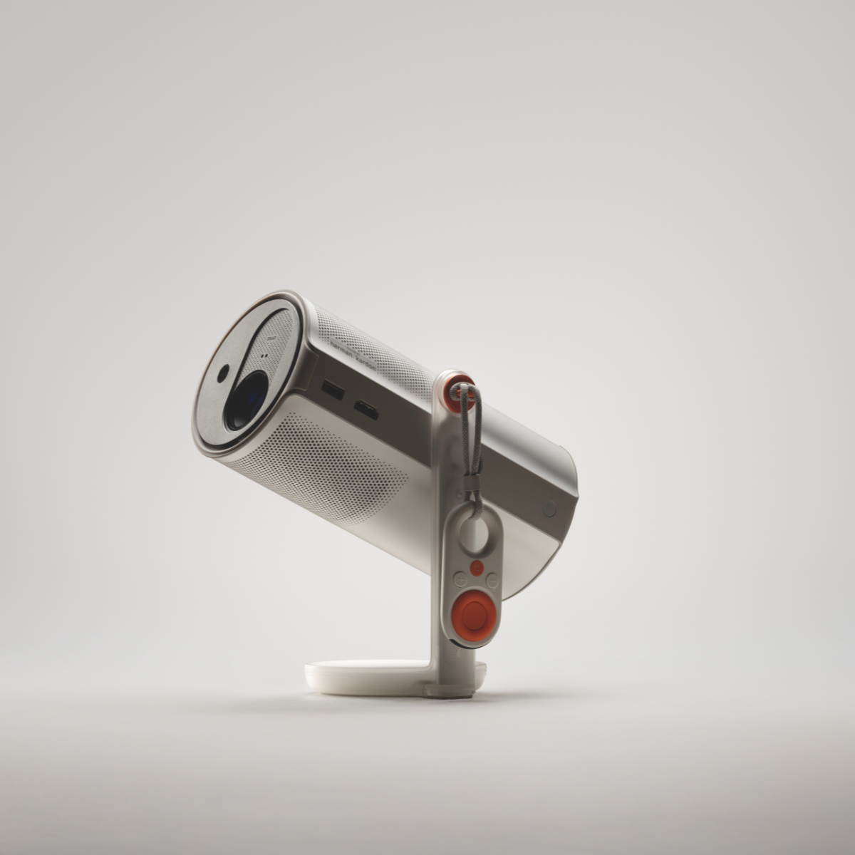 Srebrny projektor ze stojakiem i pomarańczowym sterowaniem na białym tle.