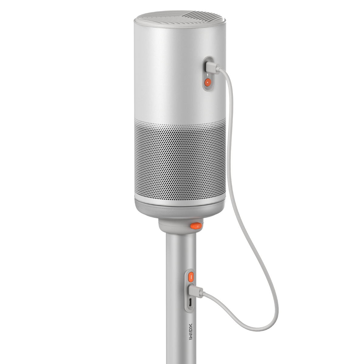 Dispositivo de altavoz blanco y plateado con un cable de carga adjunto. Tiene un botón naranja.