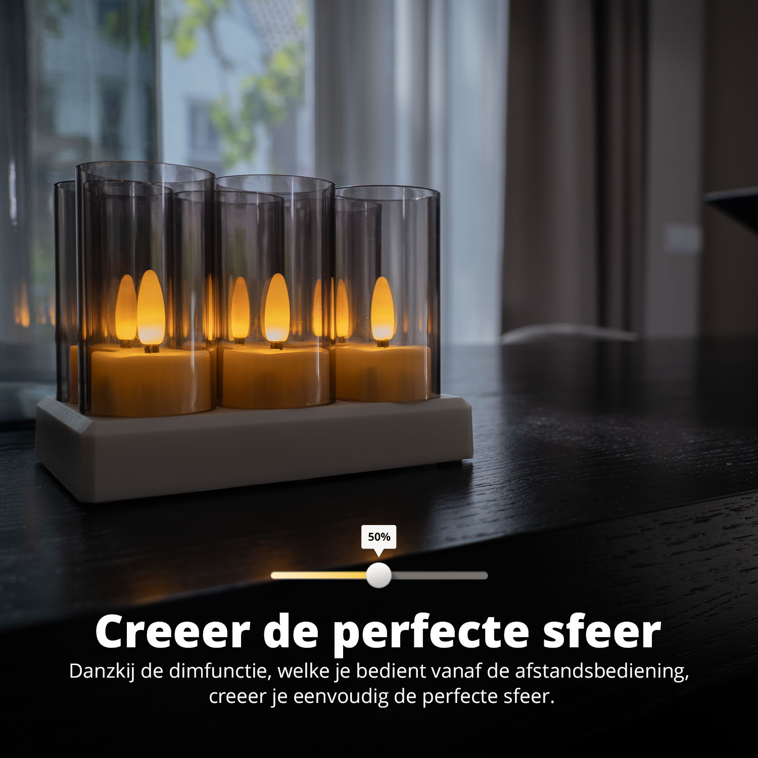 Three glass cylinders with lit candles, placed on a black table, promoting perfect ambiance.