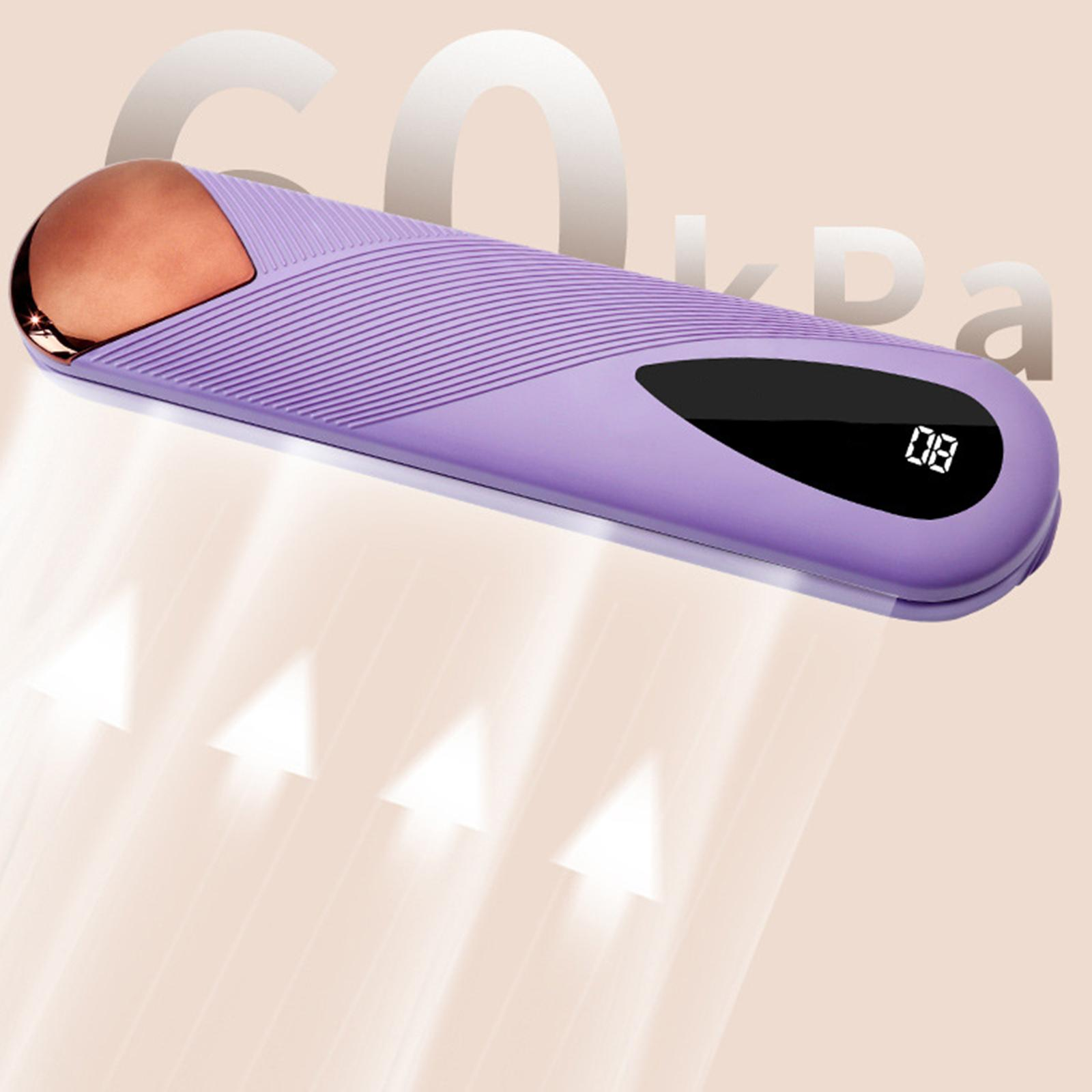 Lila Gesichtsmassagegerät mit roségoldener Spitze und Digitalanzeige. Tan-Hintergrund.