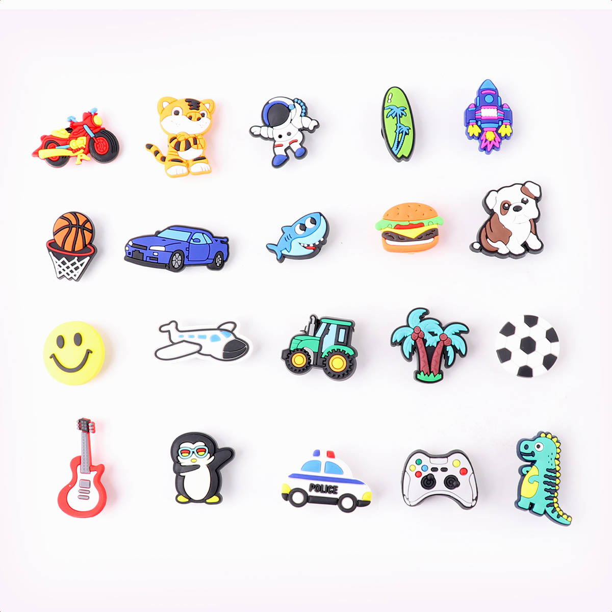 Various stickers on white background.  Cars, smiley, airplane, shark, burger, dog and more.