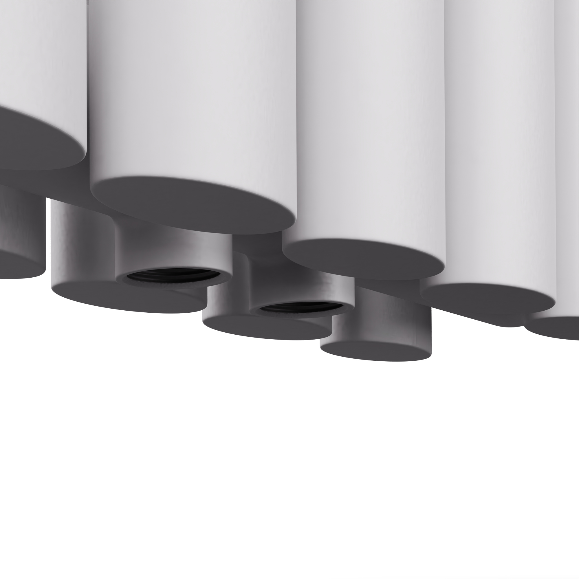 Primer plano de columnas de radiador redondeadas blancas. Fondo blanco.