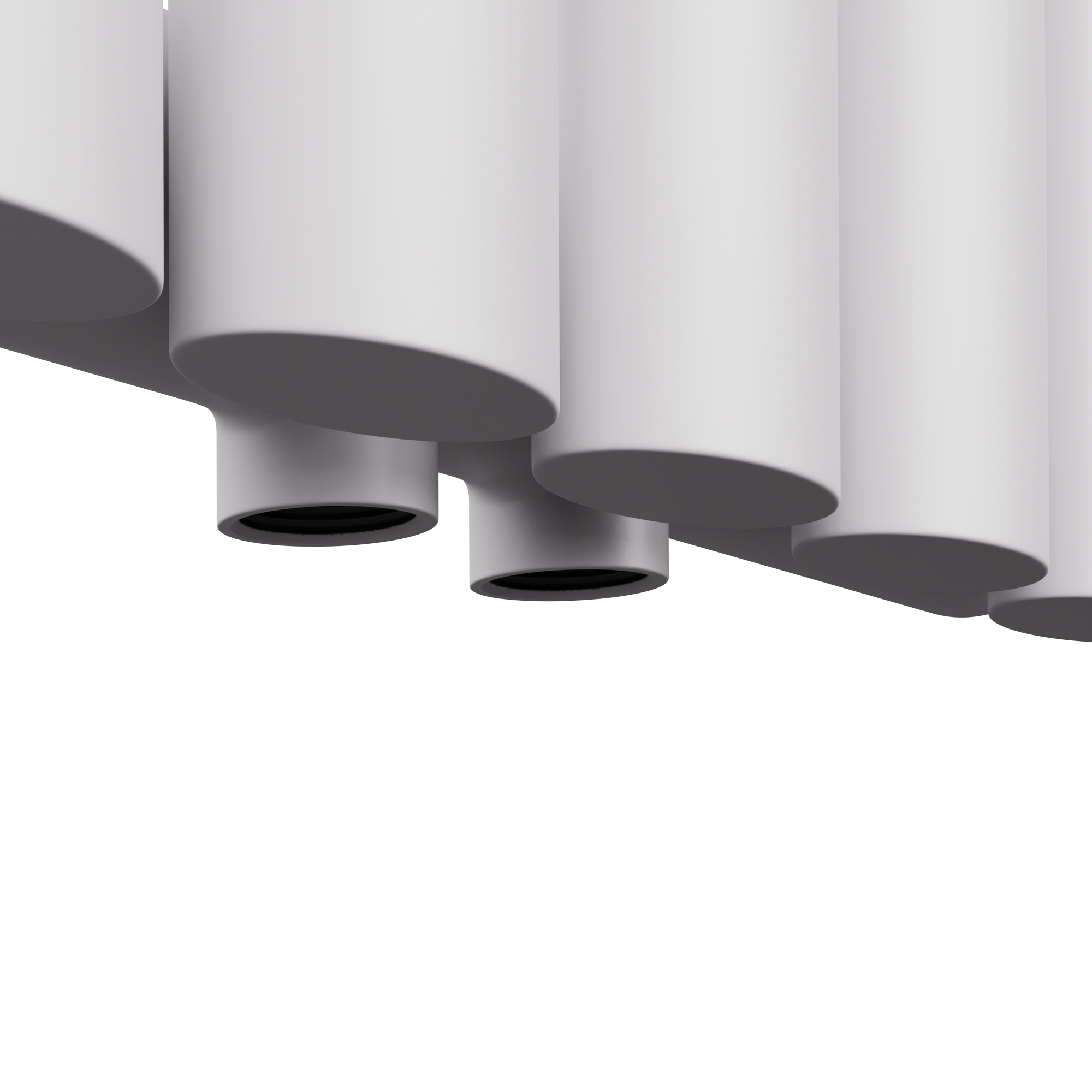 Primer plano de tubos de radiador cilíndricos blancos, sobre fondo blanco.