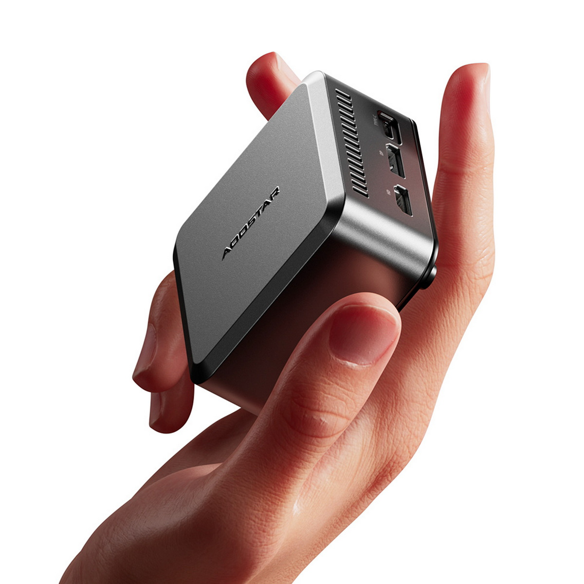 Dłoń trzyma małe, szare, prostokątne urządzenie z portami. Urządzenie ma markę ADDSTAR.