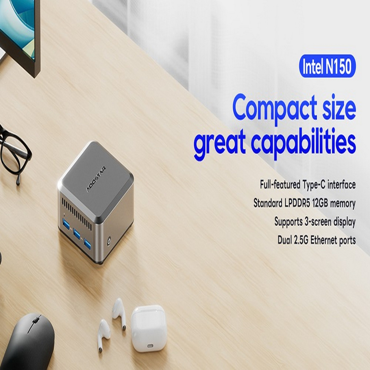 Mały srebrny komputer, słuchawki i etui ładujące leżą na biurku. Komputer ma logo ADDSTAR.