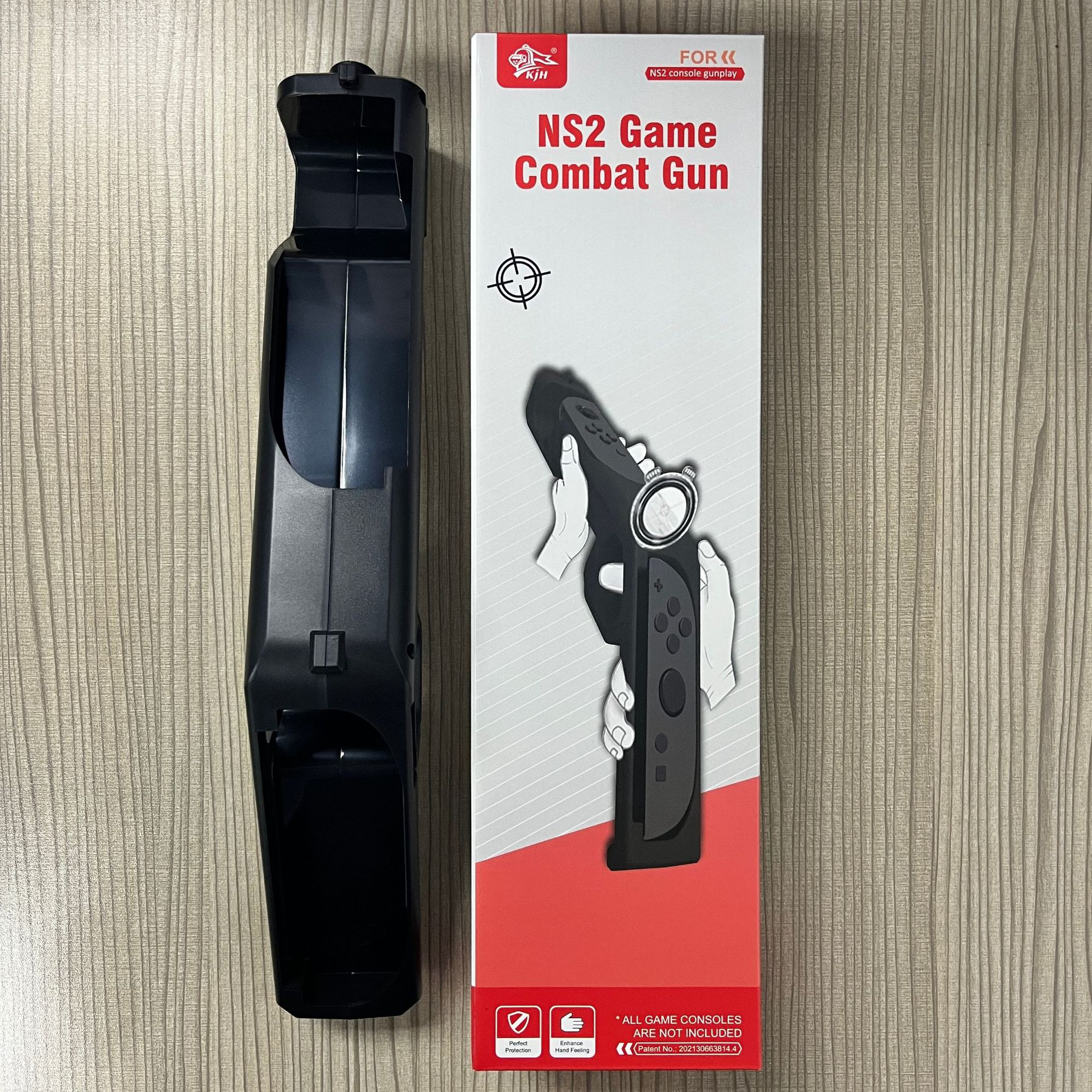 Black game gun accessory and box. Box has gun image, text, and logo.