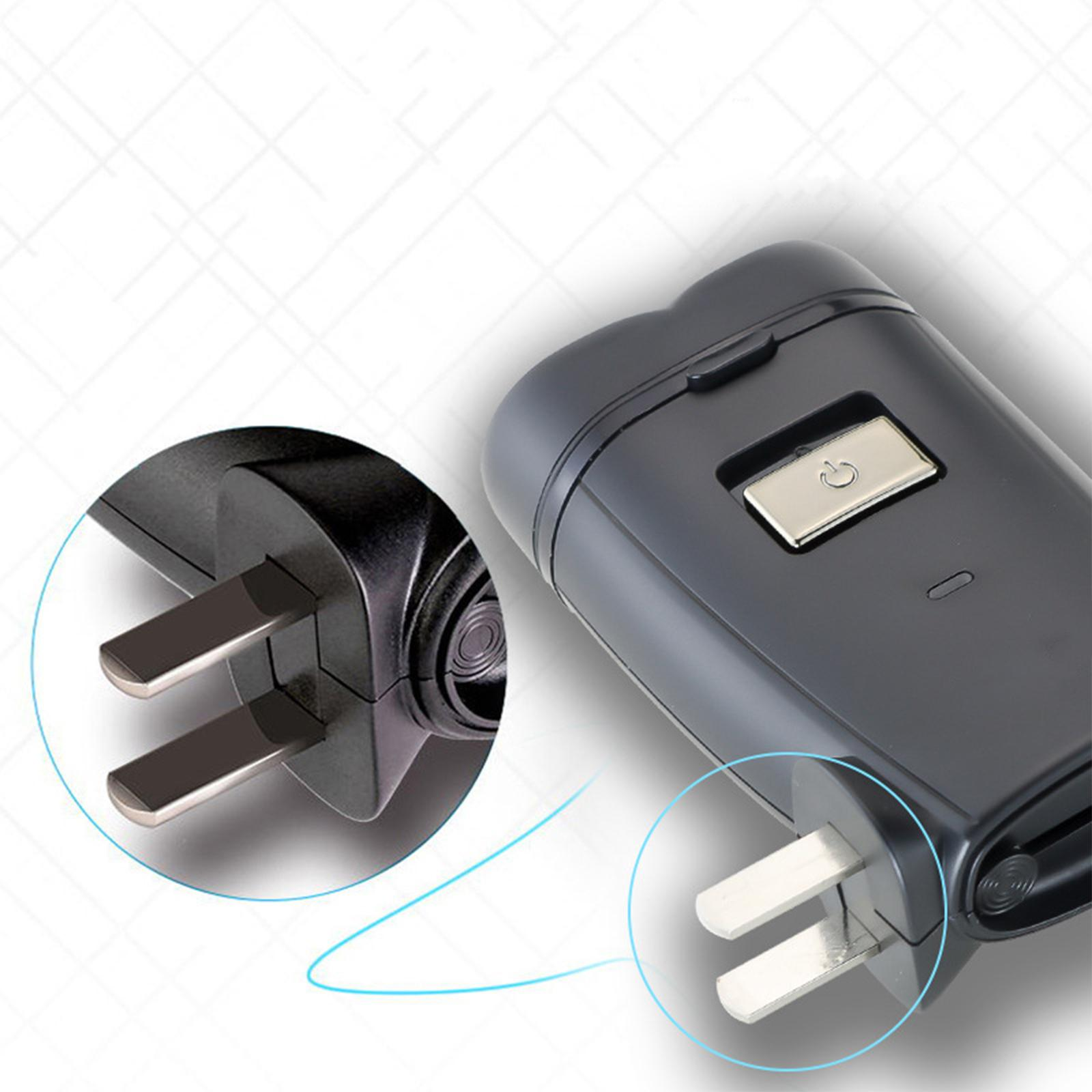 Nahaufnahme eines schwarzen Elektrorasierers und eines Netzsteckers. Rasierer und Stecker sind nebeneinander.