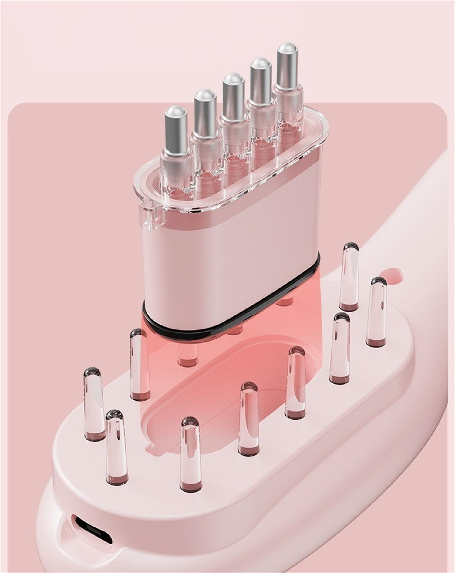 Pinke Massagebürste mit Metallborsten und transparenten Spitzen. Nahaufnahme der Bürstenborsten.