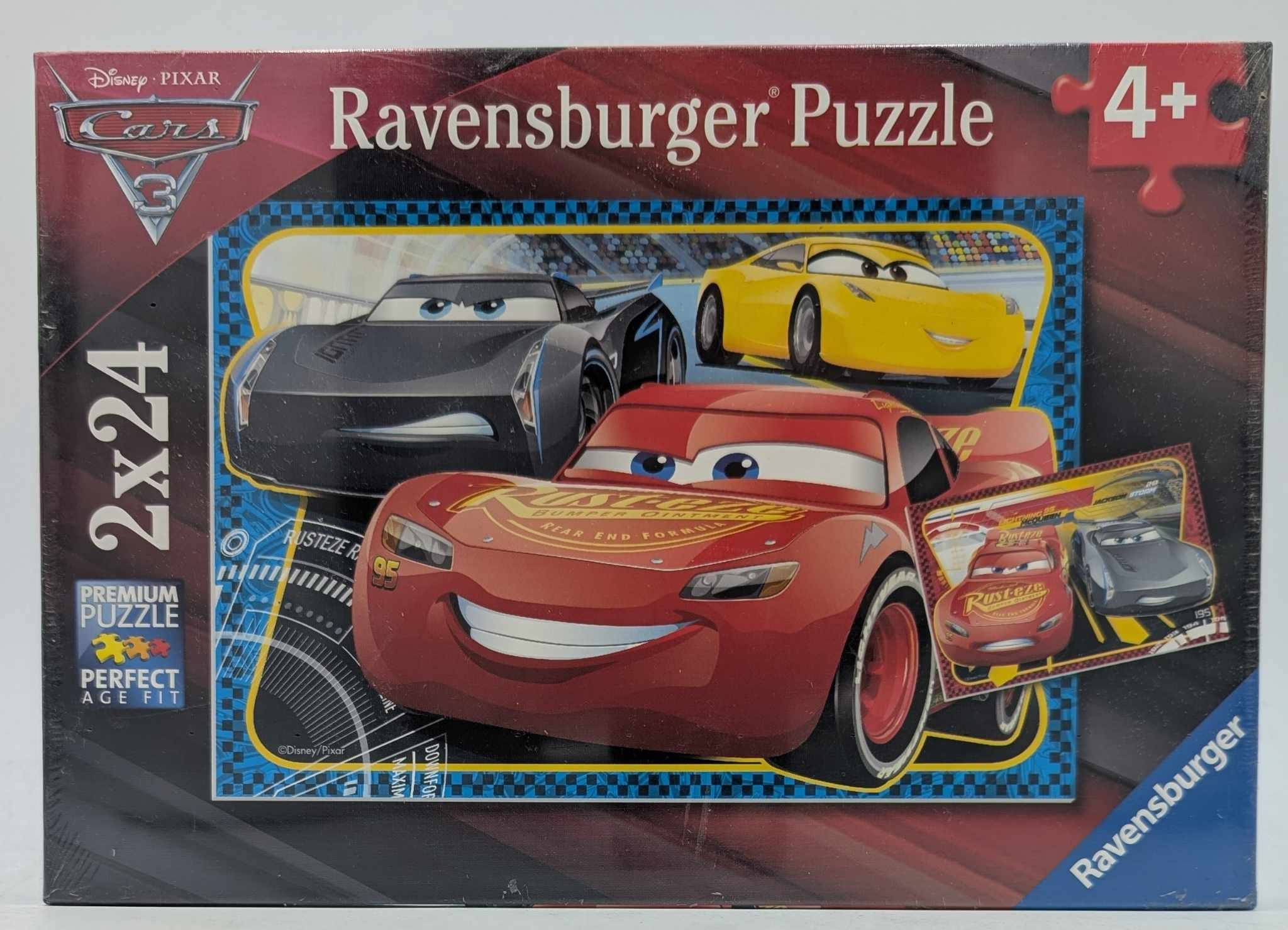 Puzzledose mit Cars 3-Charakteren: Roter Lightning McQueen, schwarze und gelbe Autos. "Ravensburger Puzzle" steht drauf.